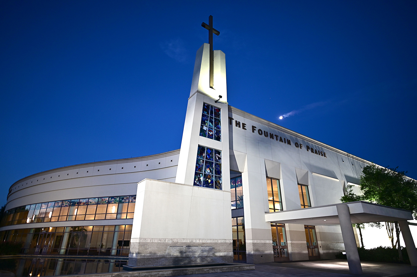 The moon is seen behind the Fountain of Praise church where services will be held for George Floyd on June 8, 2020 in Houston Texas. - Democrats vowed June 7, 2020 to press legislation to fight systemic racism in US law enforcement as the battle for change triggered by the police killing of George Floyd began shifting from the streets to the political sphere.Demonstrations continued across the nation Sunday -- including in Washington, New York and Winter Park, Florida -- as protesters began focusing their initial outrage over the death of the unarmed Floyd into demands for police reform and social justice. (Photo by Johannes EISELE / AFP) (Photo by JOHANNES EISELE/AFP via Getty Images)