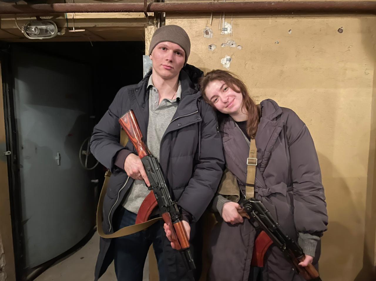 Yaryna Arieva and Sviatoslav Fursin spent their first day of marriage collecting their rifles to defend Ukraine.