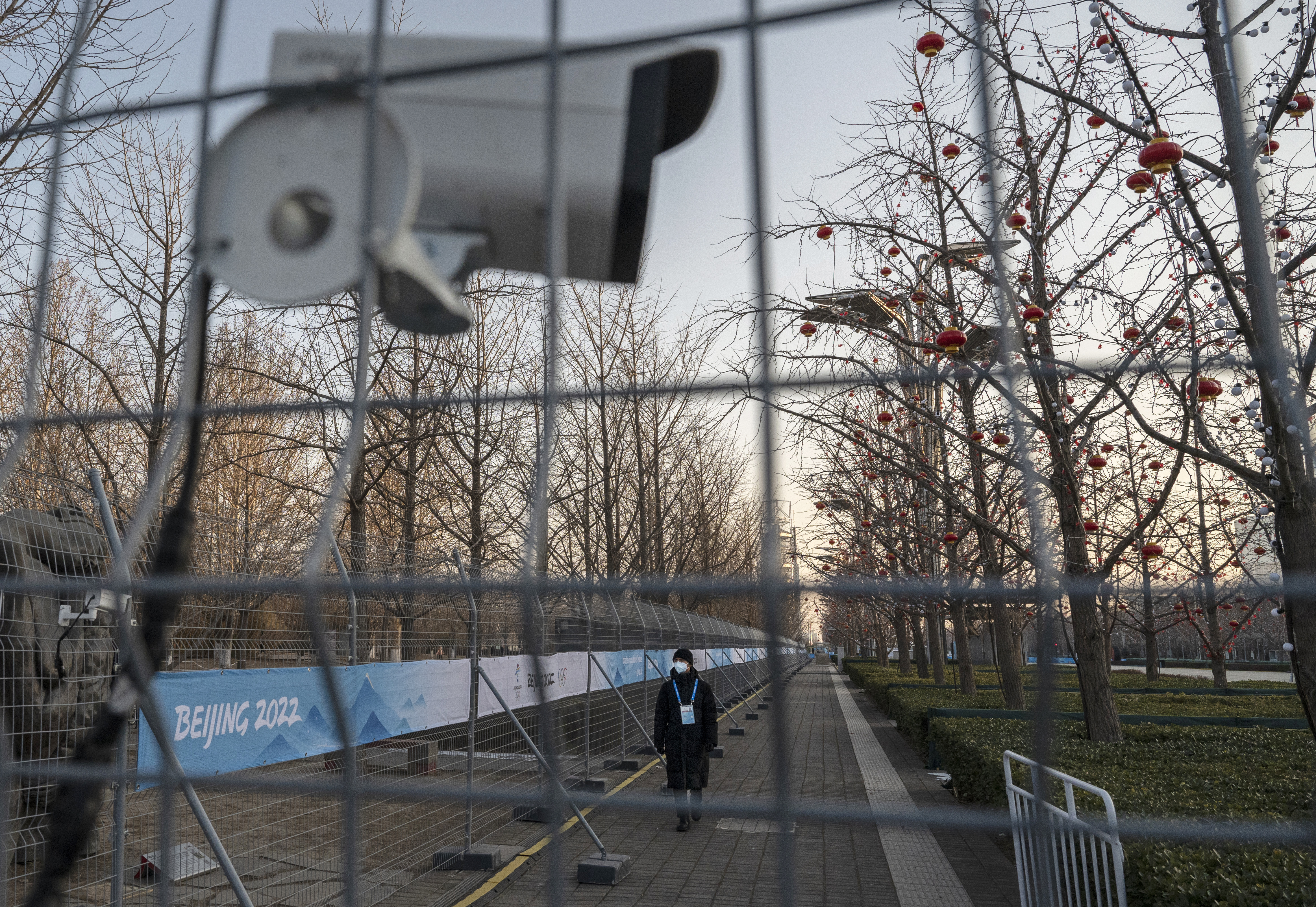 A guard walks inside the "bubble" near the main media center ahead of the Beijing 2022 Winter Olympics, at the Olympic Park in Beijing, last week. 