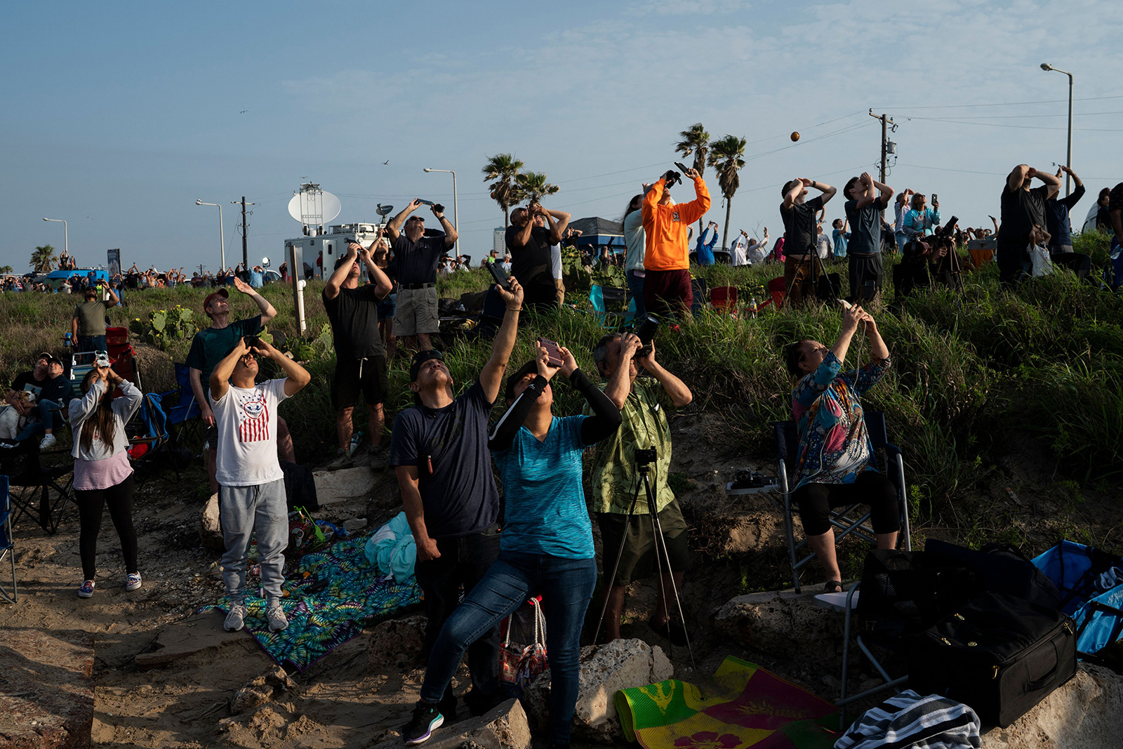 Spectators watch from South Padre Island, Texas, as the SpaceX Starship launches for the test flight on April 20.