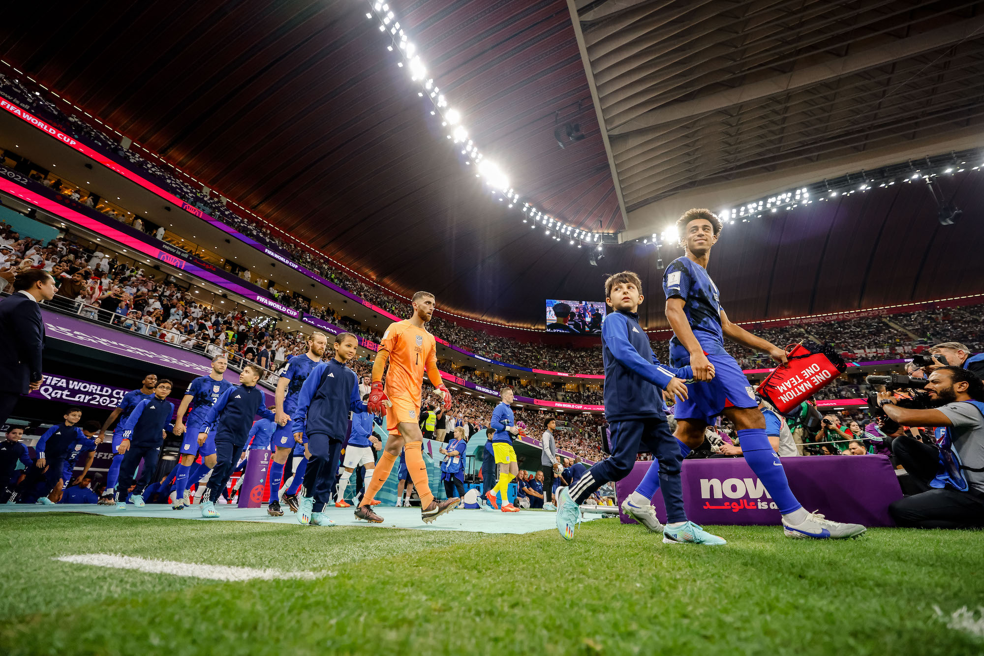 The United States team enters Al Bayt Stadium before facing England on Friday.