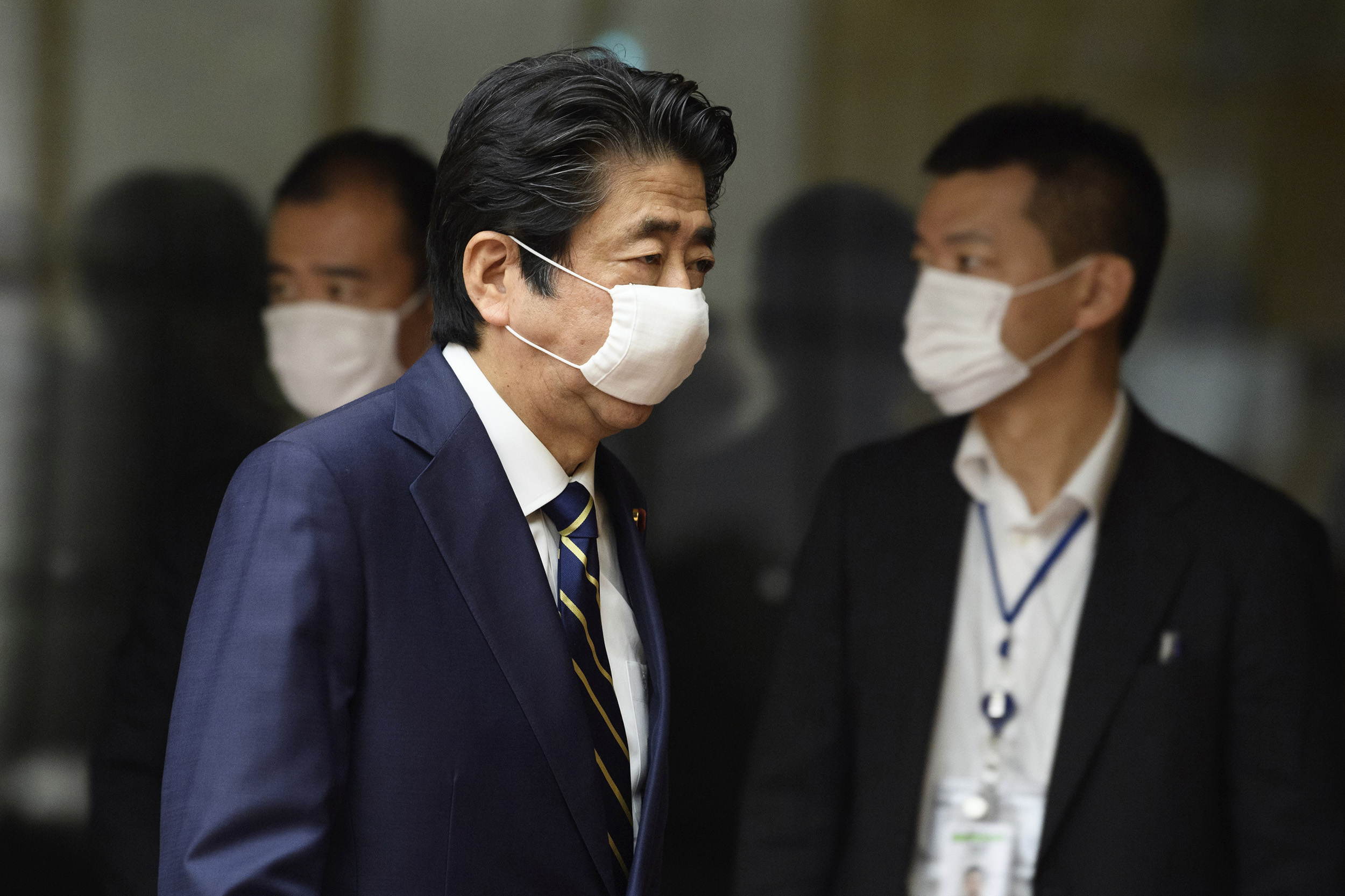 Japanese Prime Minister Shinzo Abe leaves after a press conference at his official residence in Tokyo, on Thursday, May 14. 