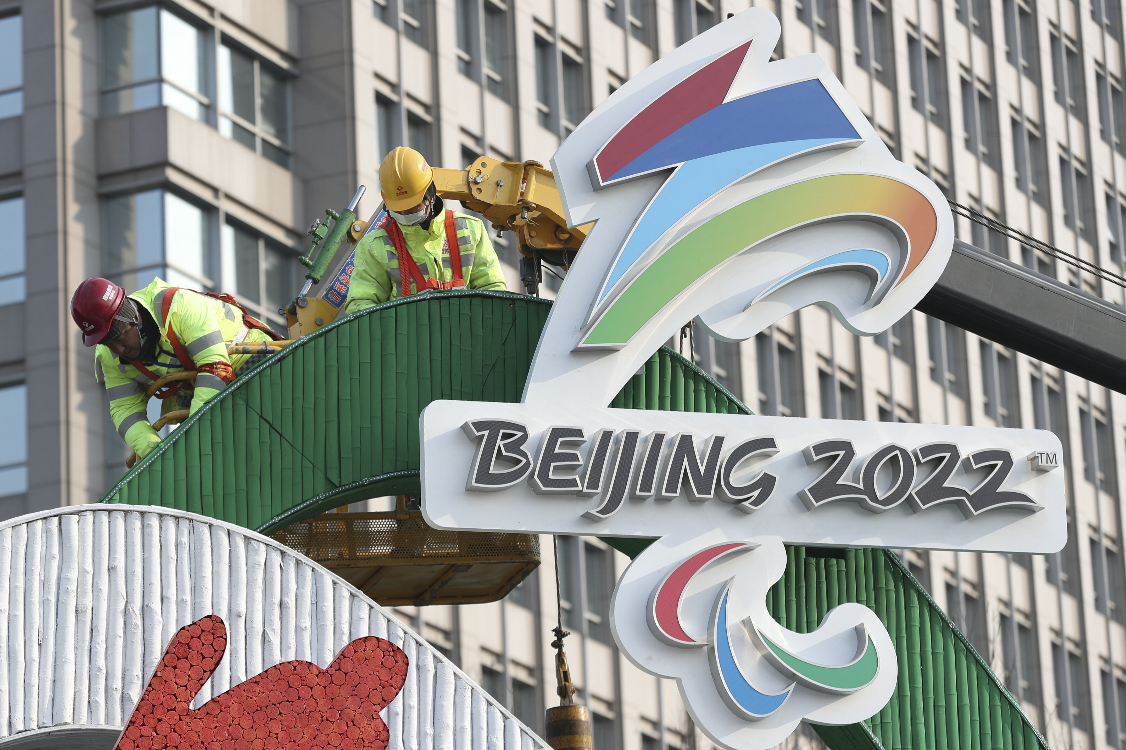 \Workers set up Winter Olympics-themed installation at Dongdan area on January 14, 2022 in Beijing, China. 