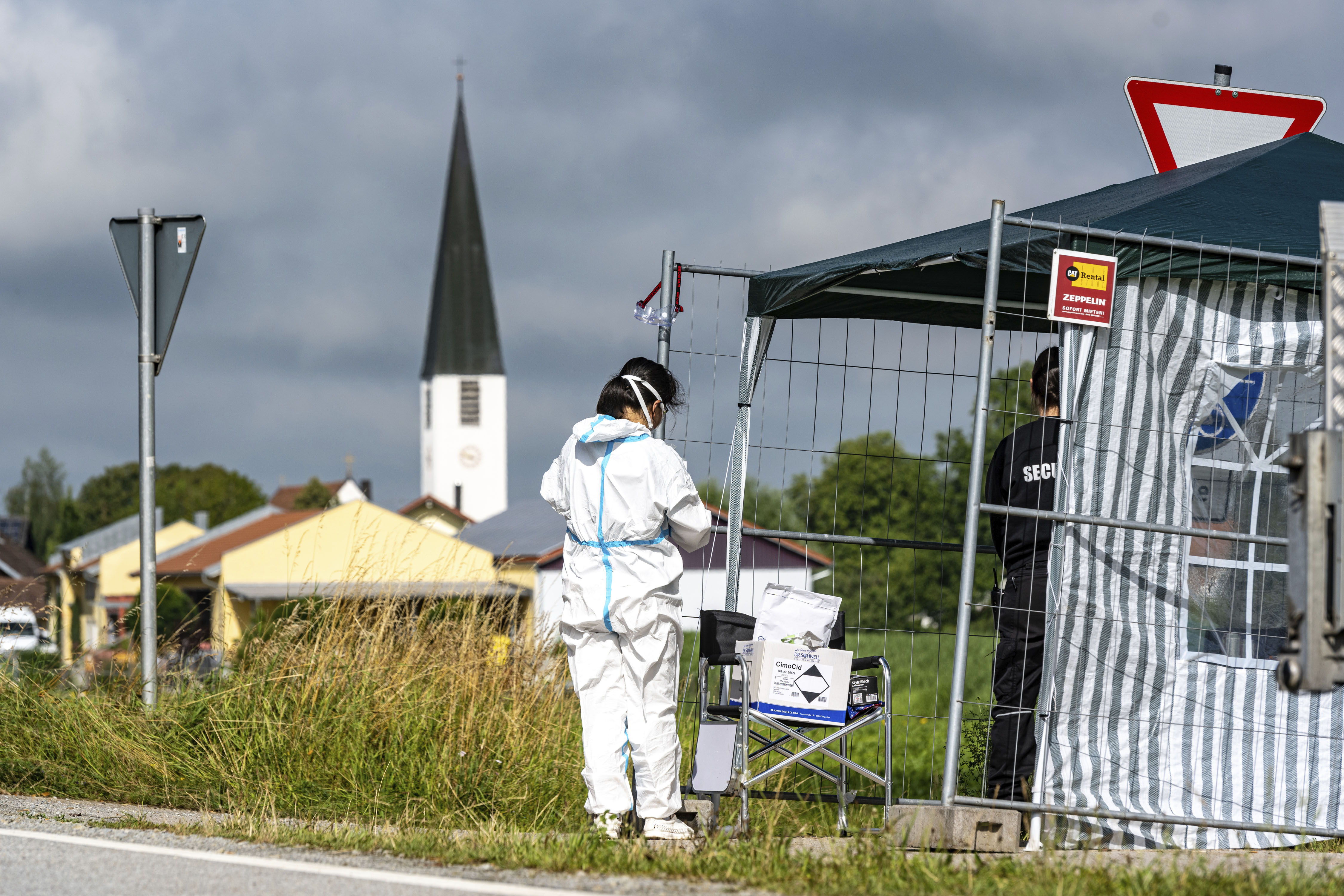 A person stands near a farm in Mamming, Germany, on July 27.