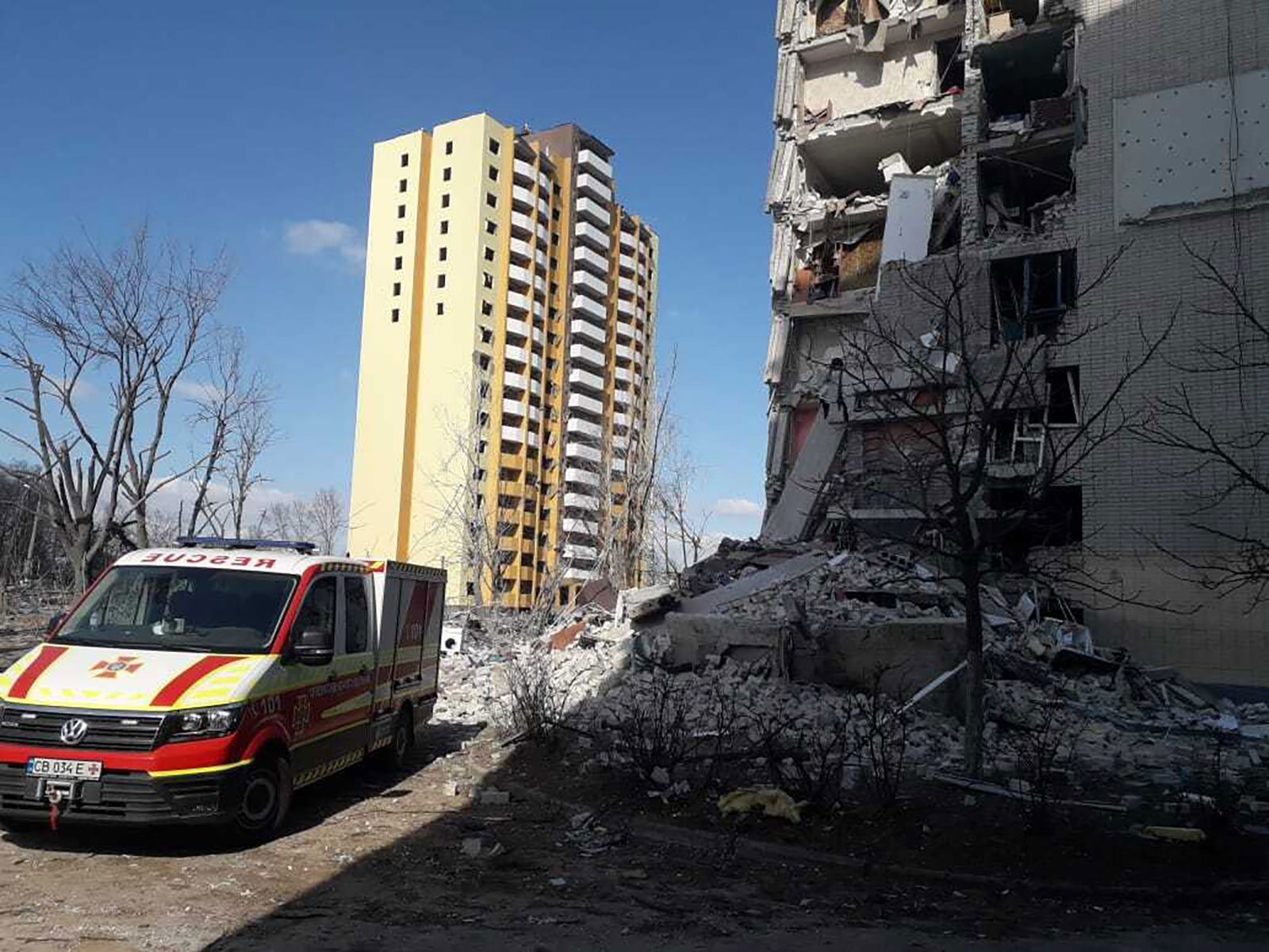 An ambulance stands ready near a damaged residential building in Chernihiv, Ukraine, on Thursday.