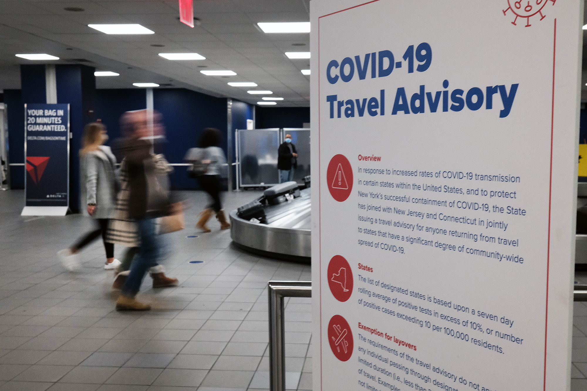 Signs warn travelers of Covid-19 in New York’s LaGuardia Airport on November 24, 2020 in New York City. 