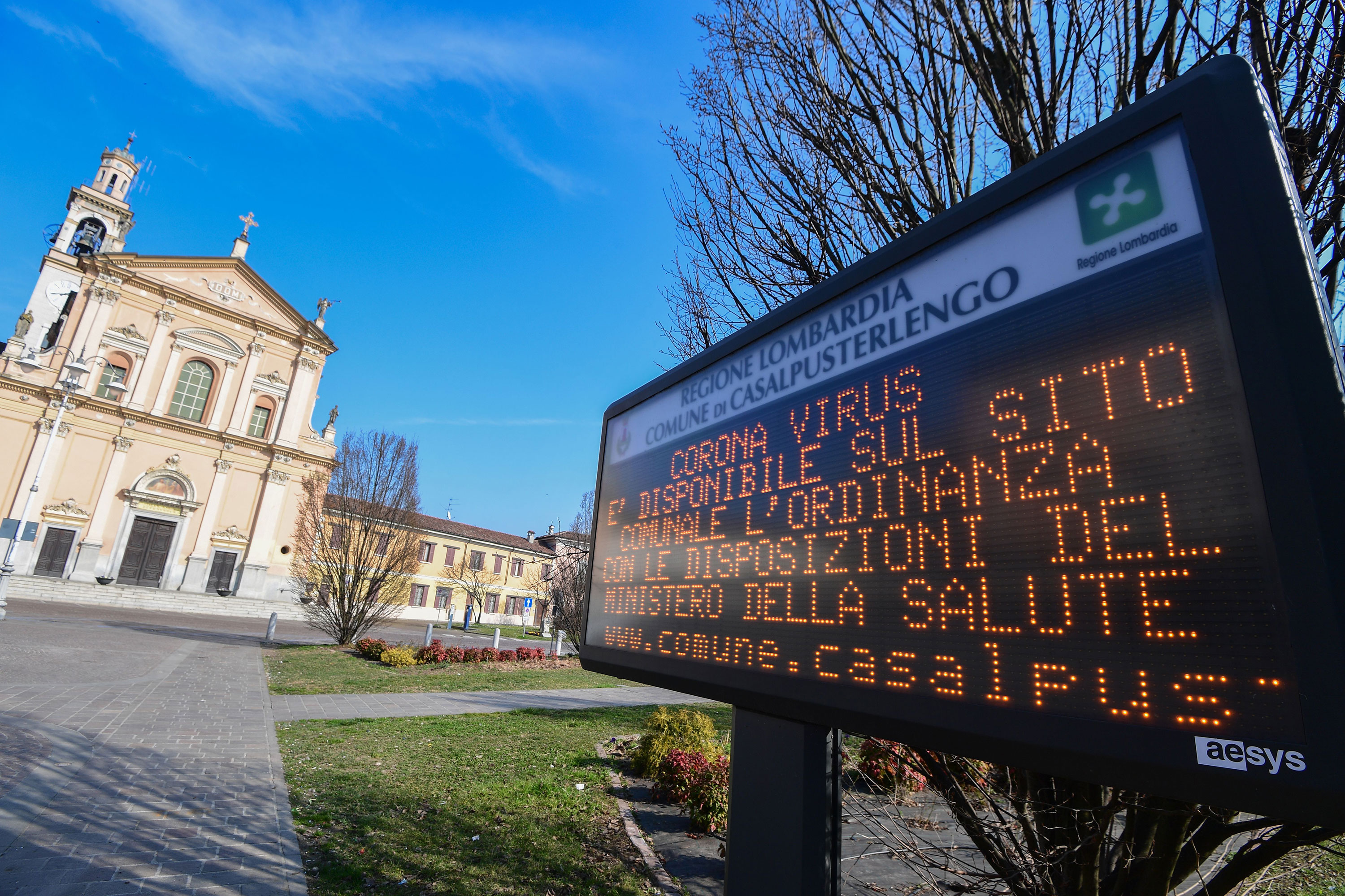 A municipal information sign reads "Coronavirus, the ordinance with the requirements of the Ministry of Health is available on the municipal website" is pictured in the village of Casalpusterlengo, on February 22.