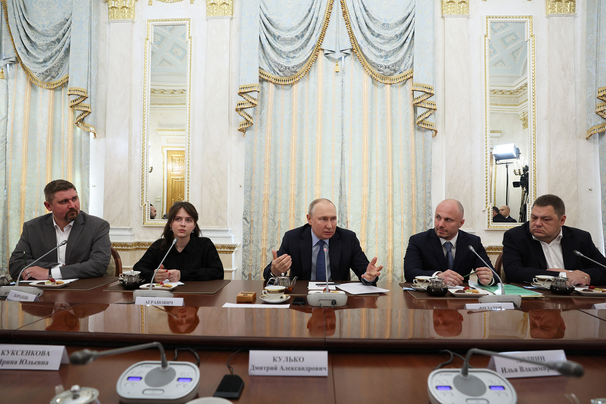Russian President Vladimir Putin, center, attends a meeting with war correspondents at the Kremlin in Moscow, Russia, on June 13.