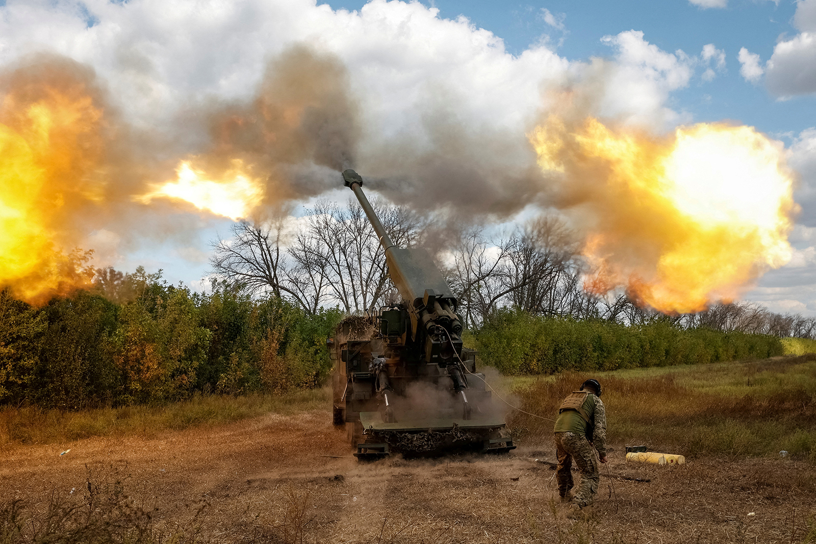 A Ukrainian serviceman fires a 2S22 Bohdana self-propelled howitzer towards Russian troops, amid Russia's attack on Ukraine, at a position in Donetsk region, Ukraine on September 13.
