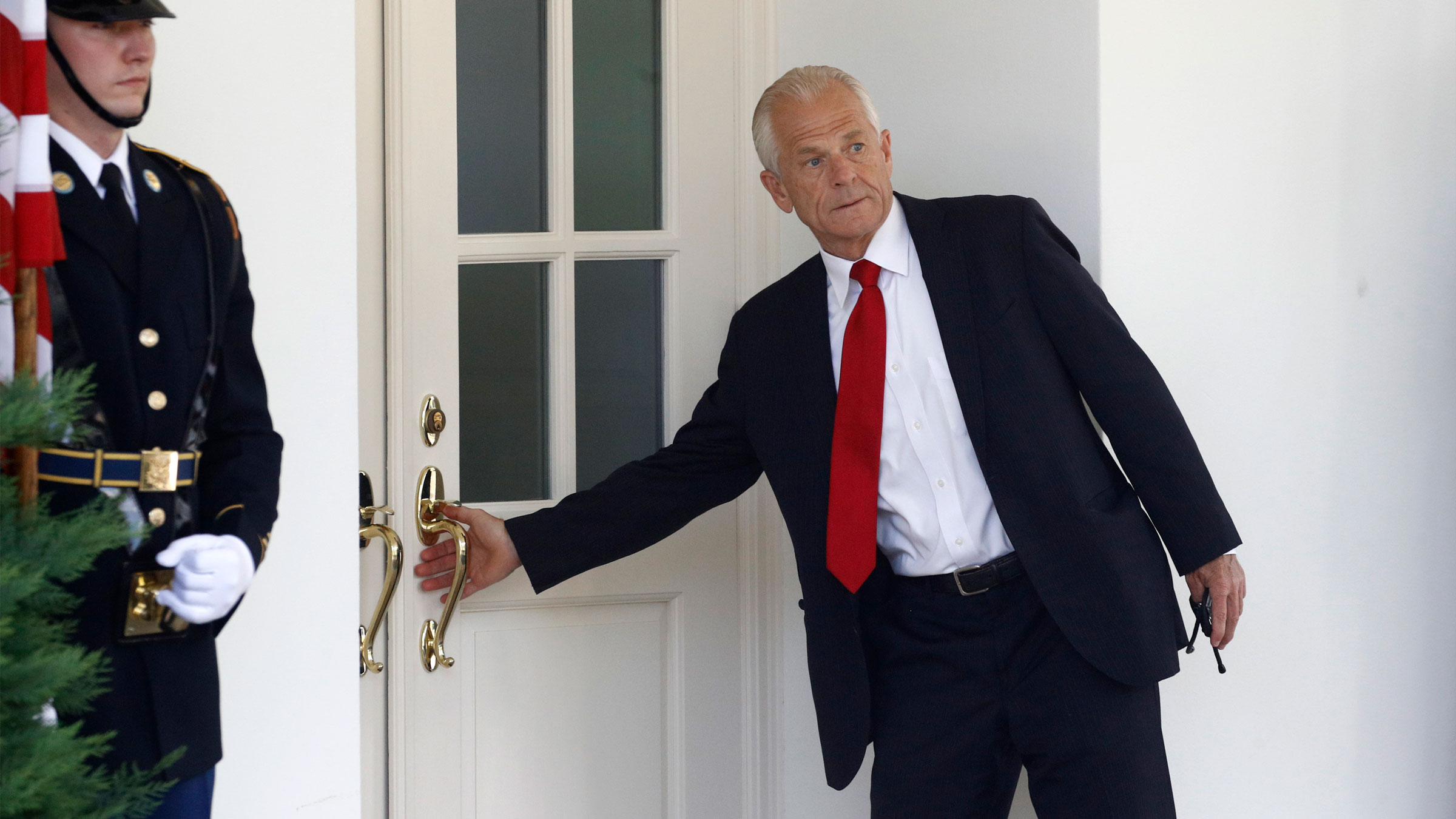 White House trade adviser Peter Navarro enters the West Wing of the White House on July 8.