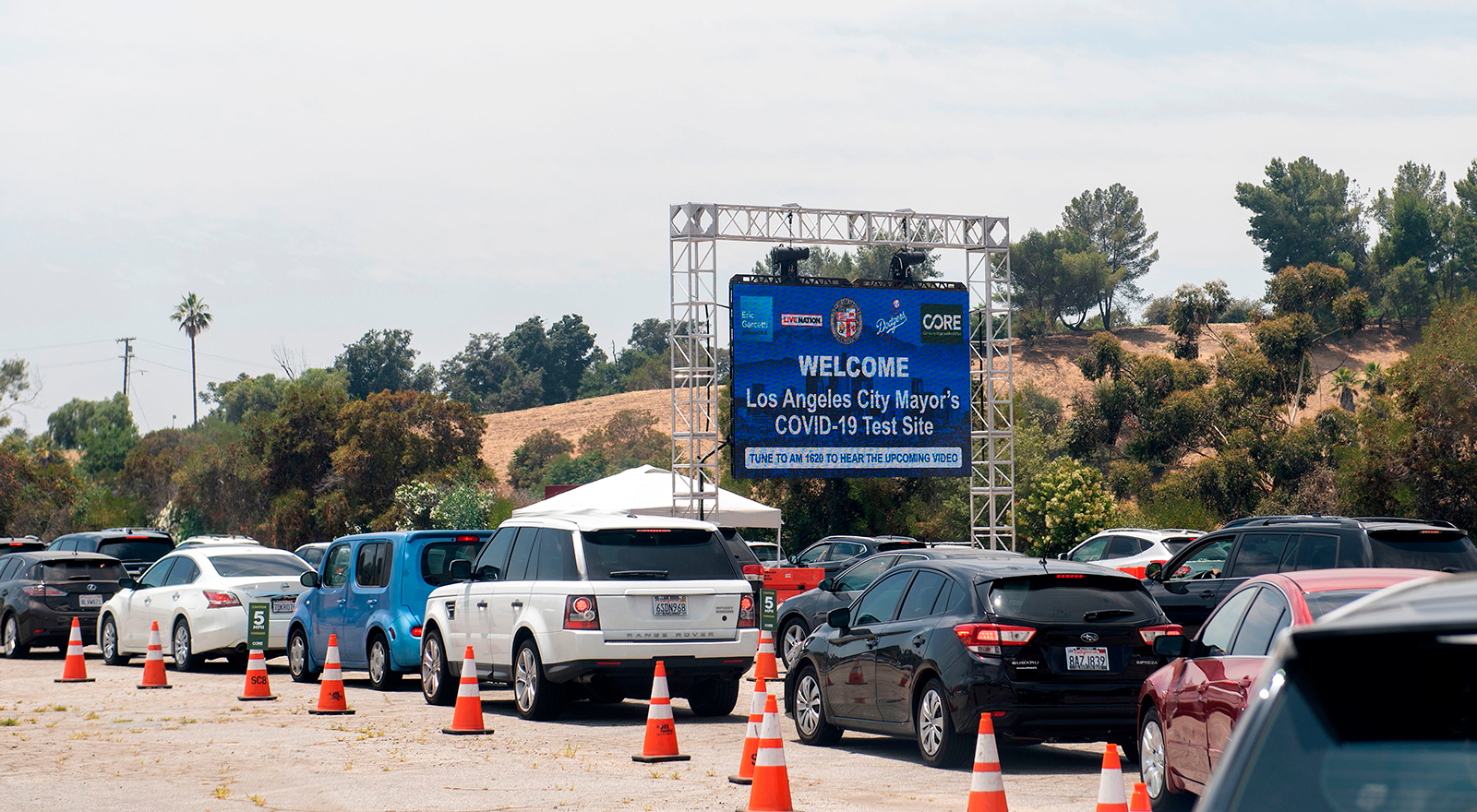 Cars wait in line at a Covid-19 testing center at Dodger Stadium, on June 25, in Los Angeles, California.