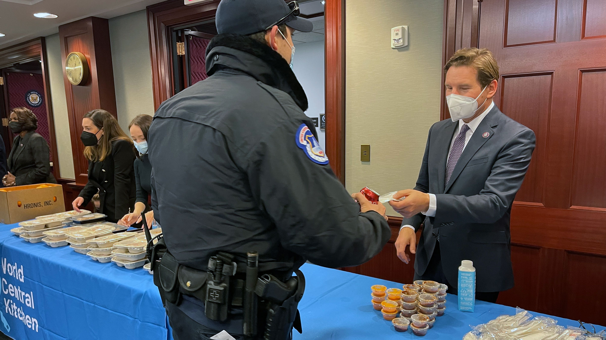 US Rep. Dean Phillips helps distribute lunch to Capitol workers on Thursday.