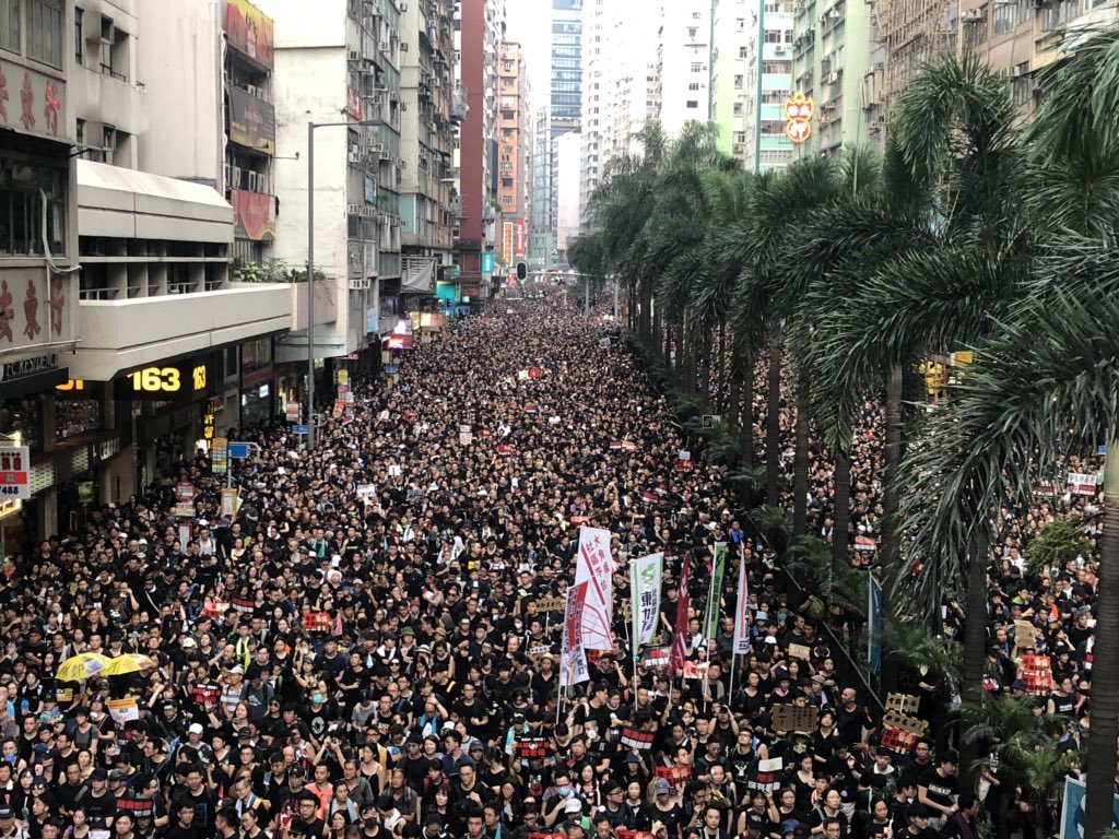 Large crowds participate in Sunday's protest march in Hong Kong.