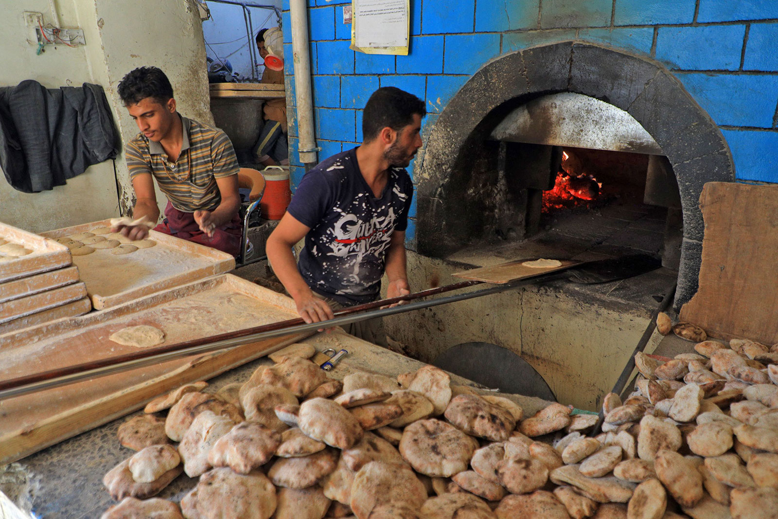 Workers prepare bread at a bakery in the Yemeni capital, Sanaa, on February 28. 