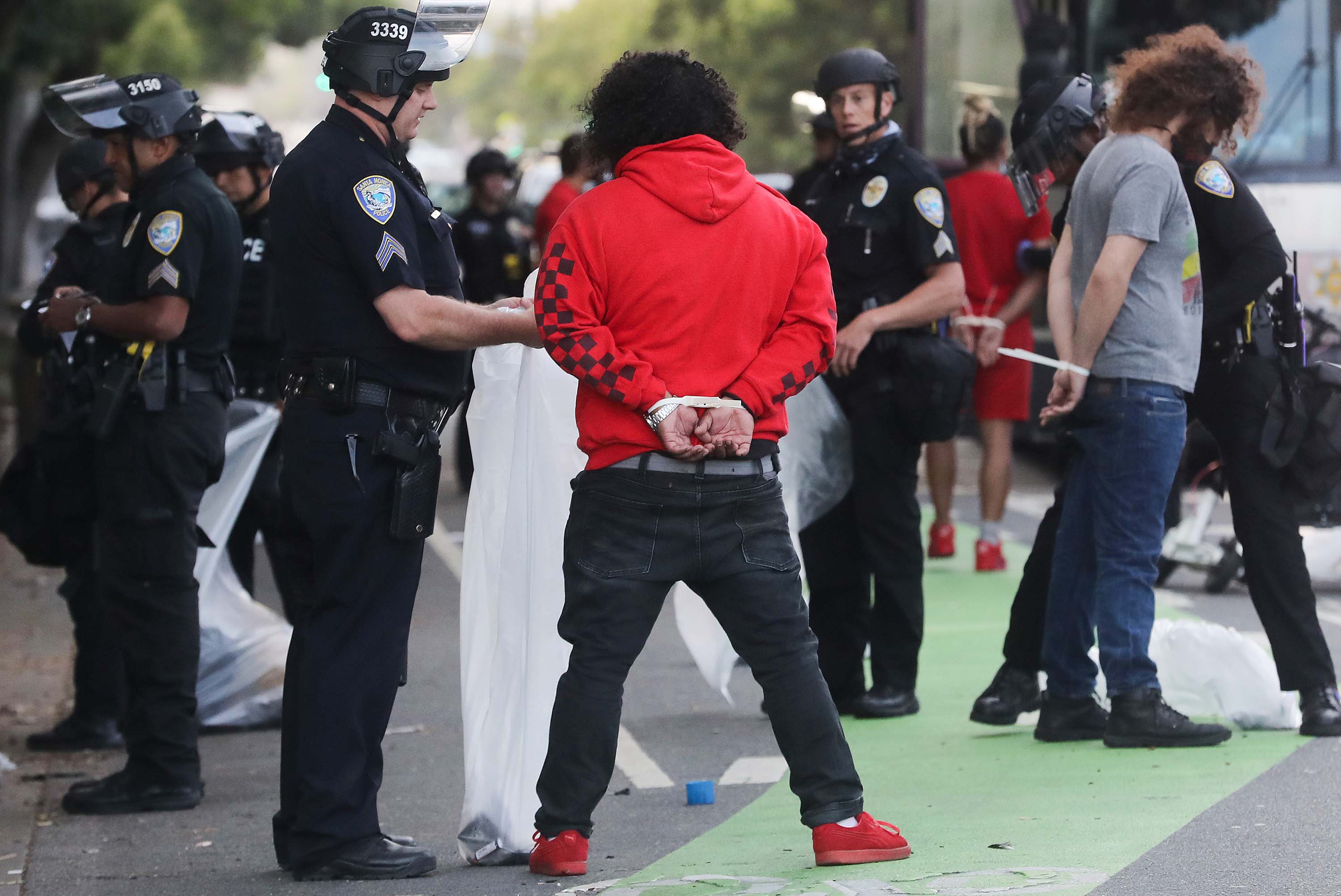 Police arrest people amid demonstrations and some ransacking in Santa Monica, California, in the aftermath of George Floyd’s death on May 31. 