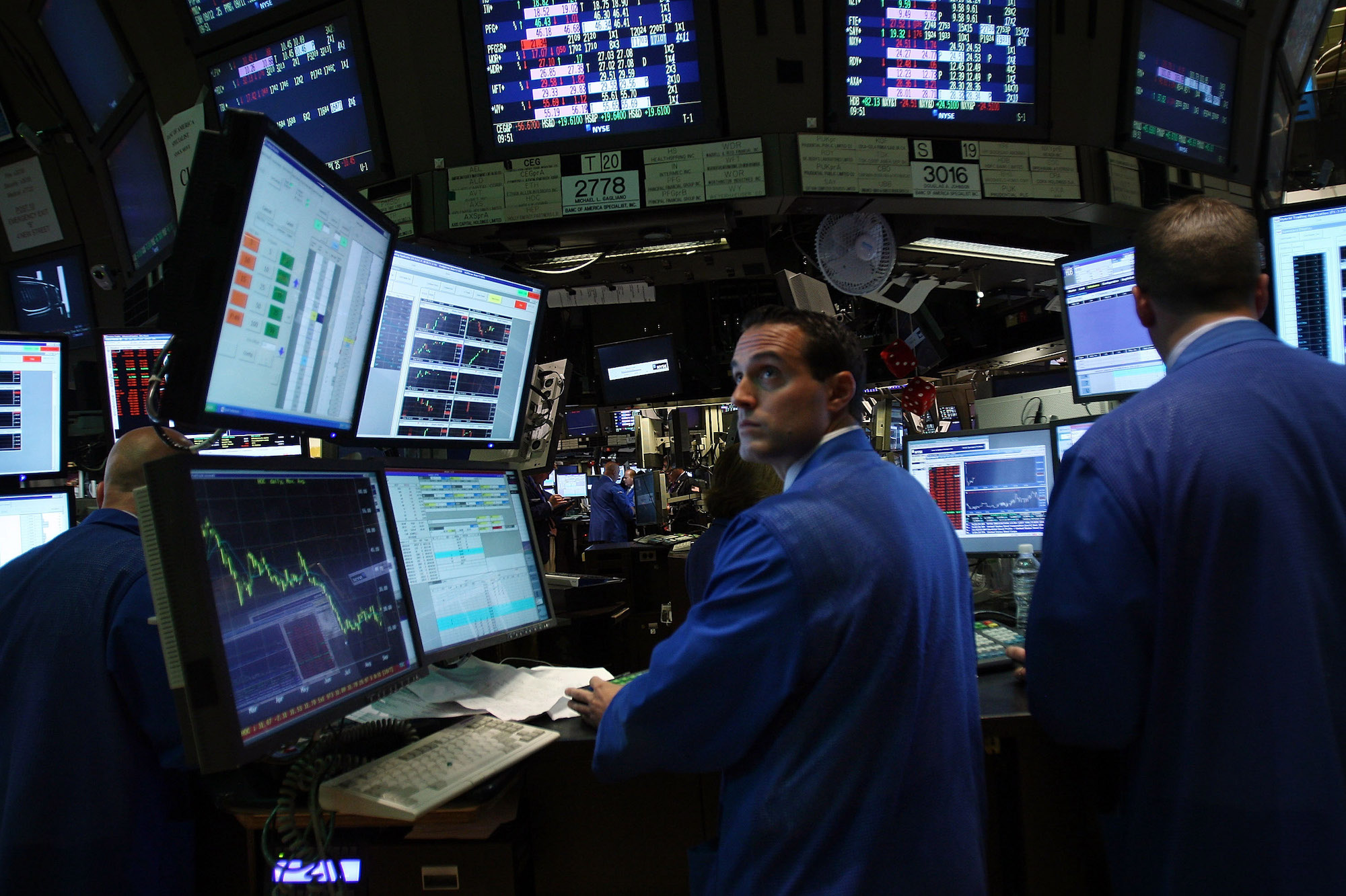 Traders work on the floor of the New York Stock Exchange on September 15, 2008.