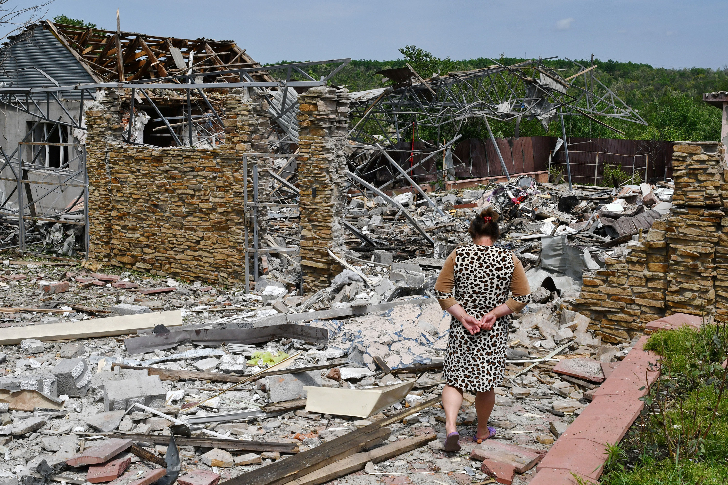 A woman walks amongst the destruction in Sloviansk, Ukraine, on June 1.