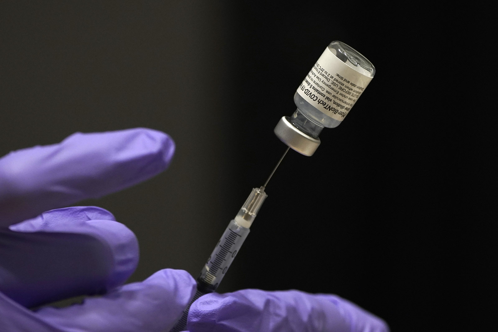 A pharmacist prepares a syringe of the Pfizer BioNtech Covid-19 vaccine in Tucson, Arizona, on January 15.