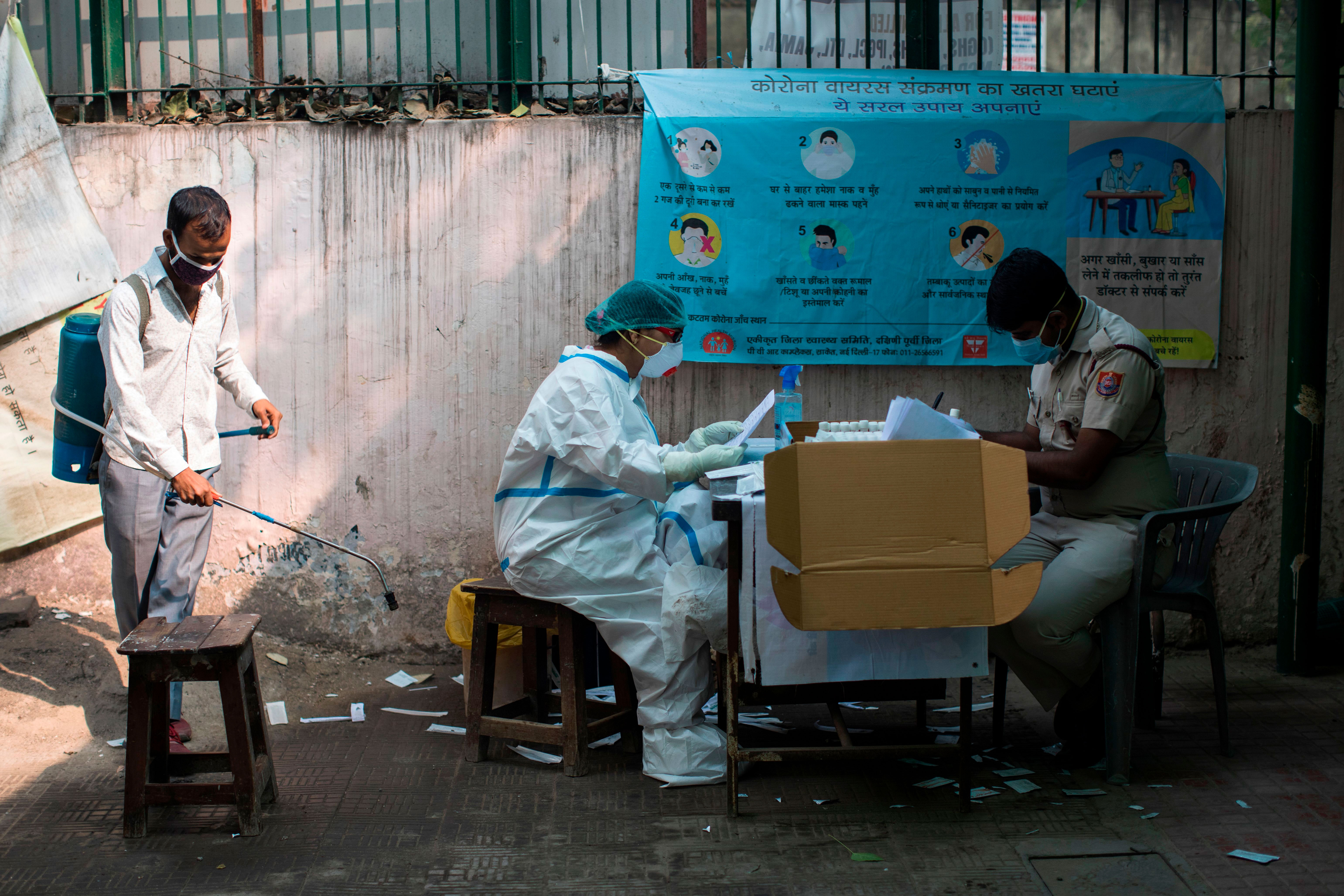 Workers sort swab samples for Covid-19 rapid antigen tests in New Delhi on November 10.