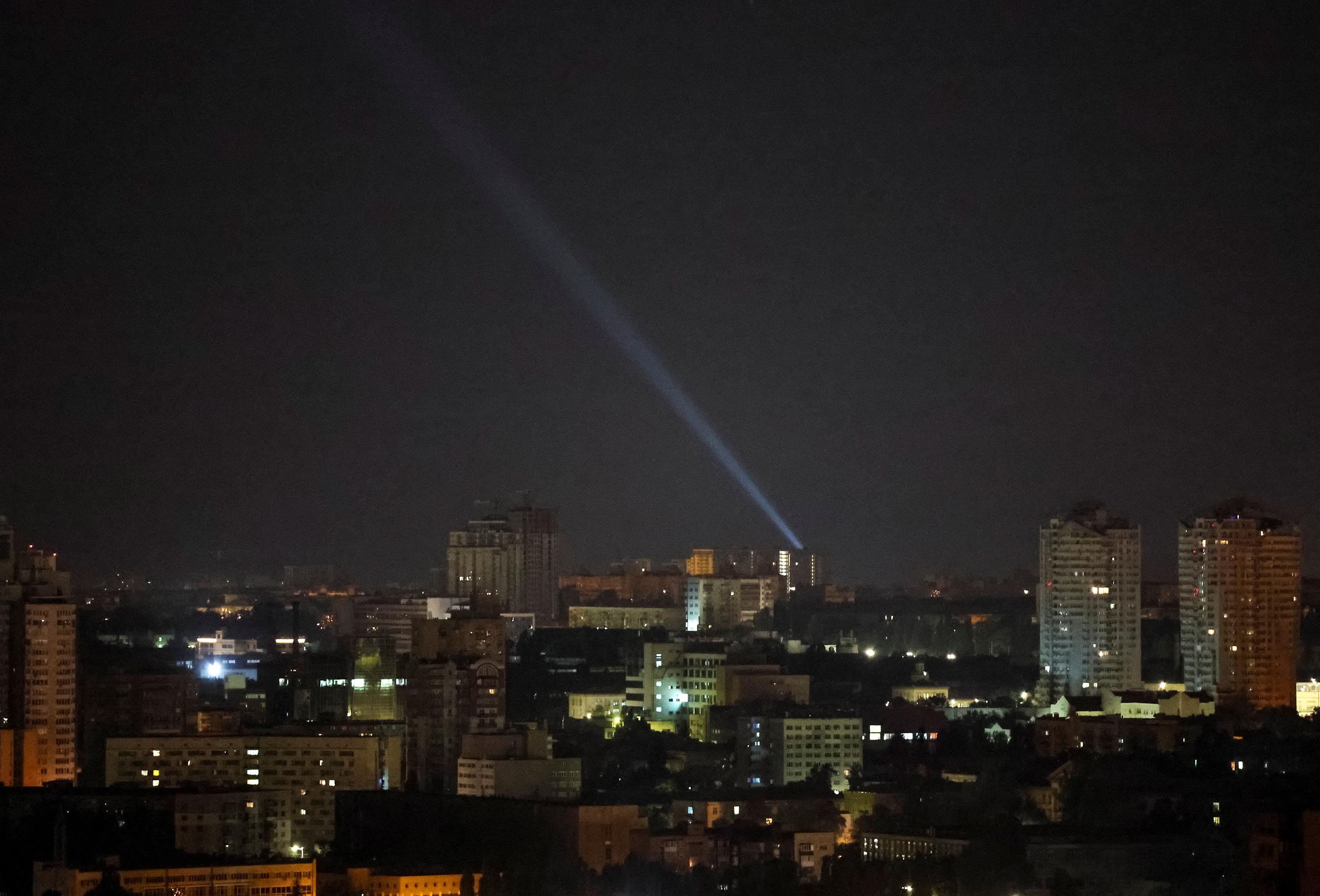 Ukrainian forces use a searchlight to scan the sky during a Russian drone strike in Kyiv, Ukraine, on July 25. 