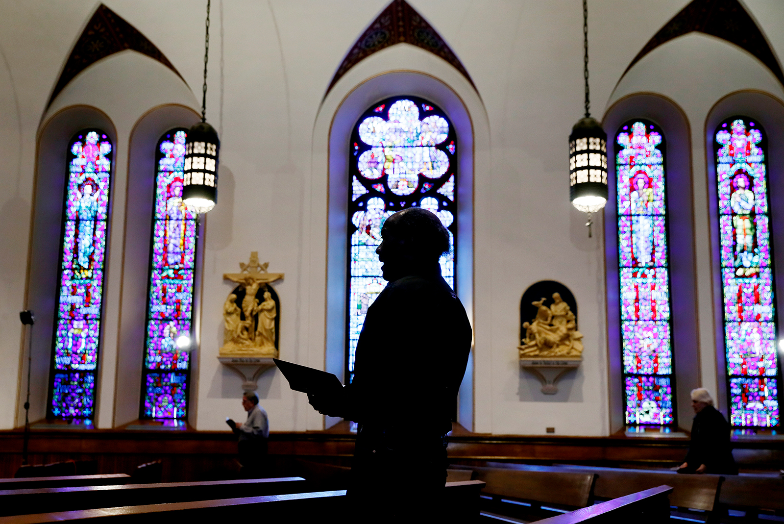 A church member prays during a Good Friday service at a church in Des Moines, Iowa on April 10.