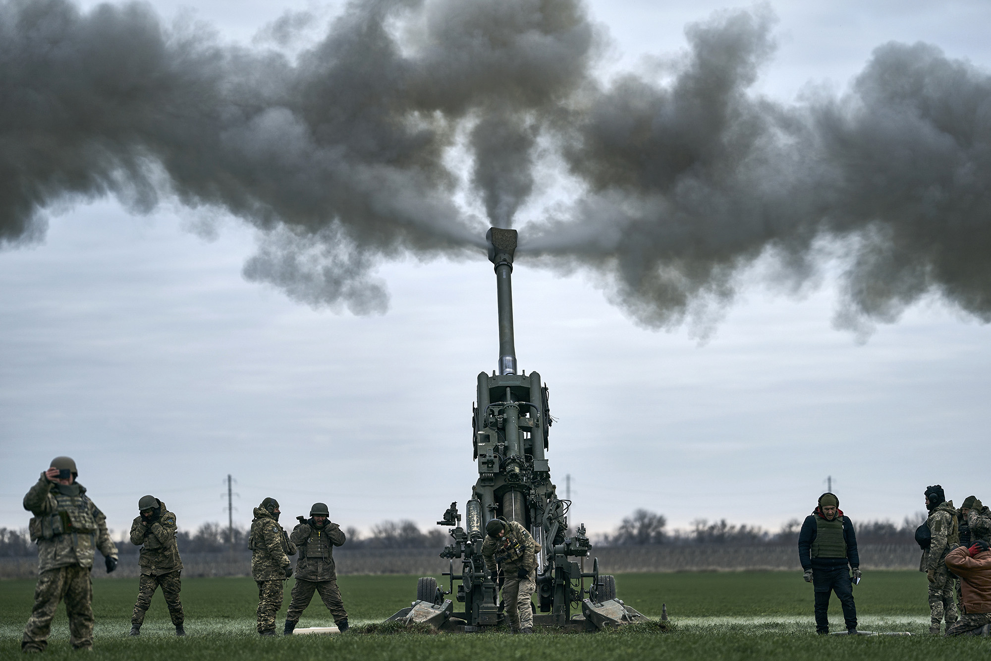 Ukrainian soldiers fire at Russian positions from a U.S.-supplied M777 howitzer in Kherson region, Ukraine, on January 9.