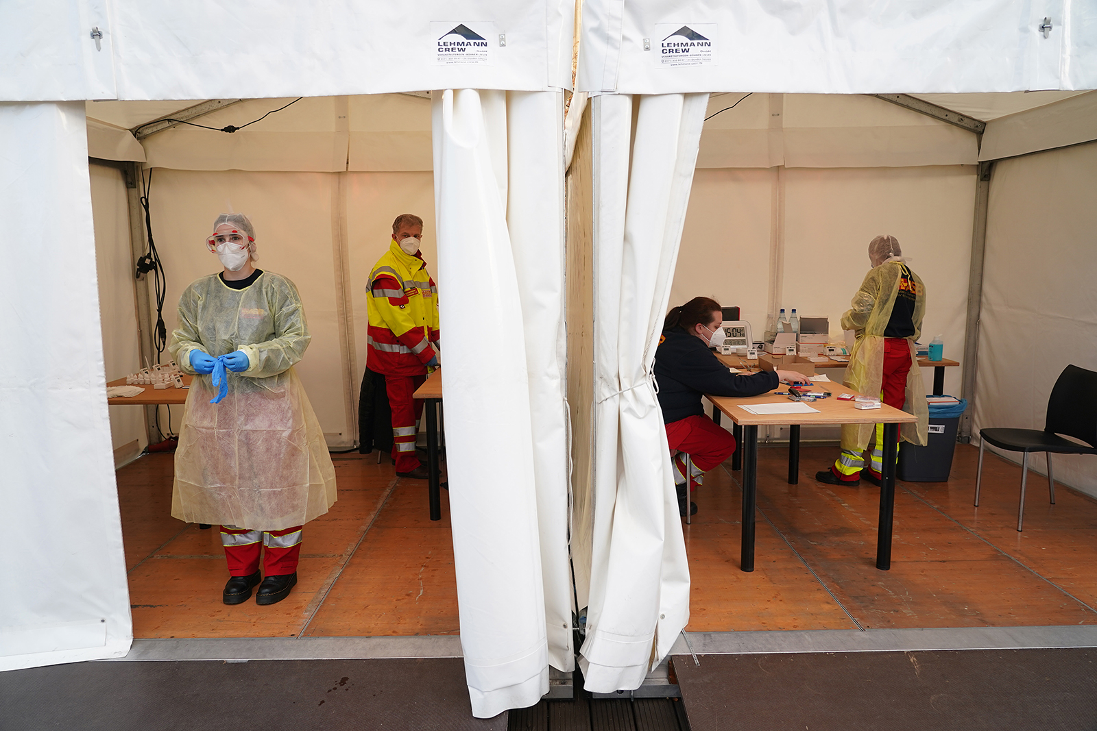 Medical workers of the ASB (Arbeiter-Samariter-Bund) charity aid agency conduct rapid antigen tests for Covid-19 infection for technical staff, journalists and party members prior to the virtual German Greens Party federal congress during the second wave of the coronavirus pandemic on November 20, in Berlin.