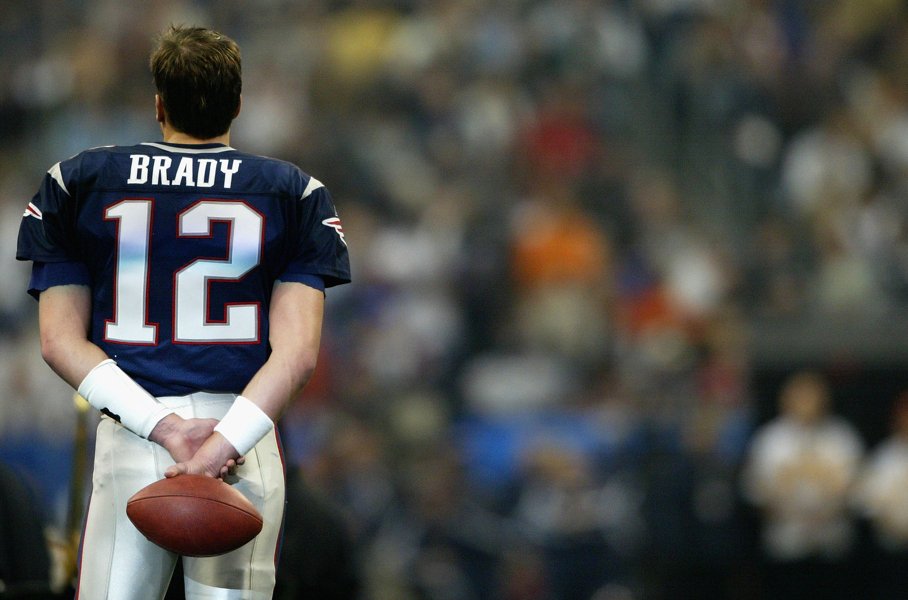 Tom Brady looks on before Super Bowl XXXVIII between the New England Patriots and the Carolina Panthers in 2004.