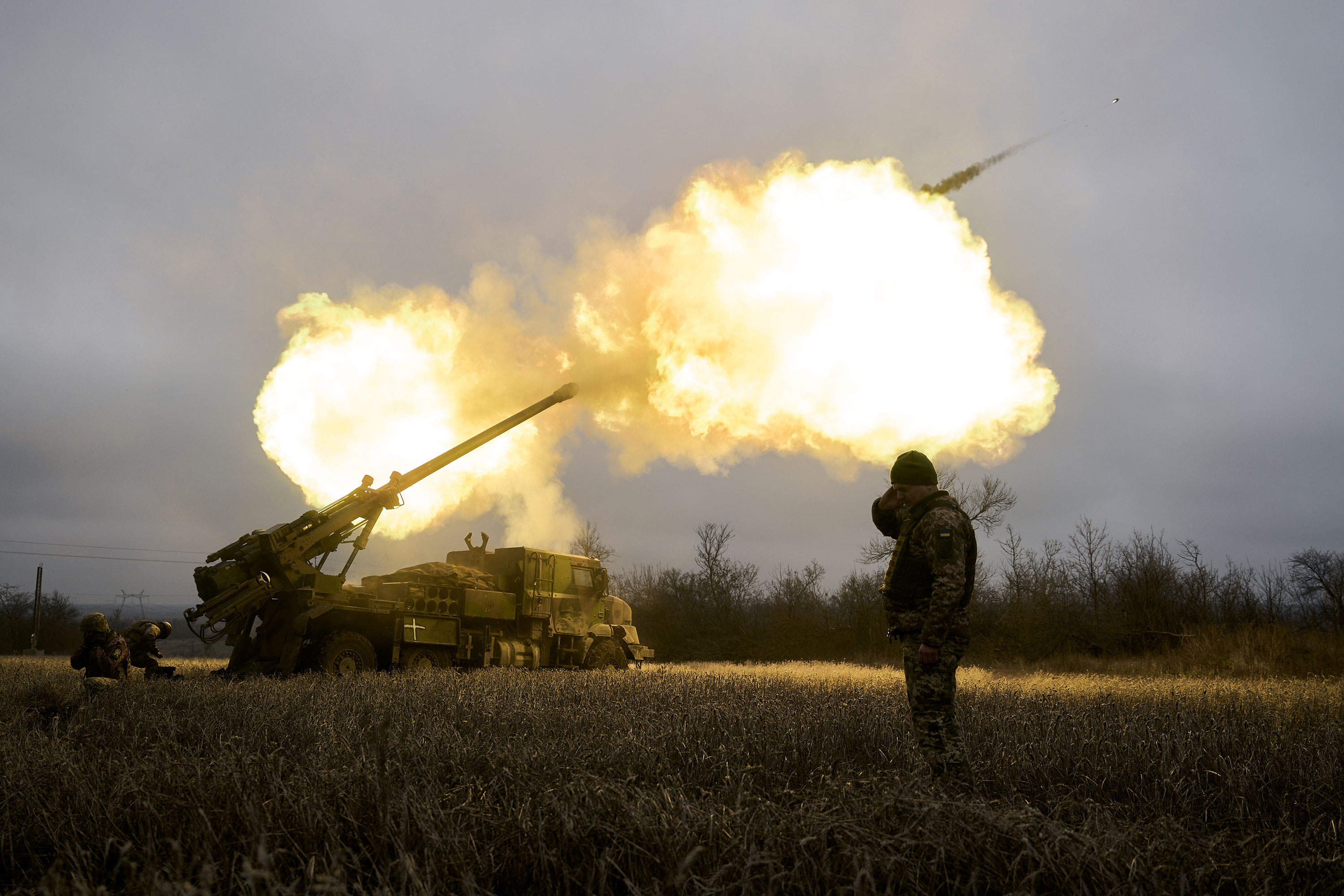 Ukrainian soldiers fire a French-made CAESAR self-propelled howitzer toward Russian positions near Avdiivka, Ukraine, on Monday.