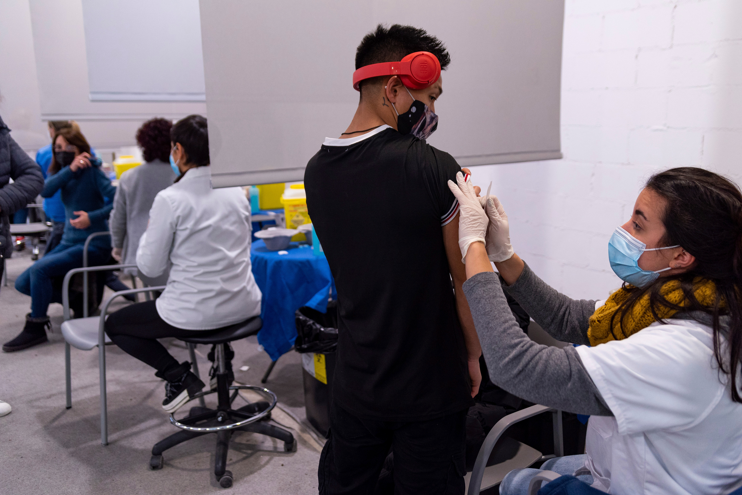 A teenage boy receives a dose of a Covid-19 vaccine in Barcelona, on December 22, 2021.