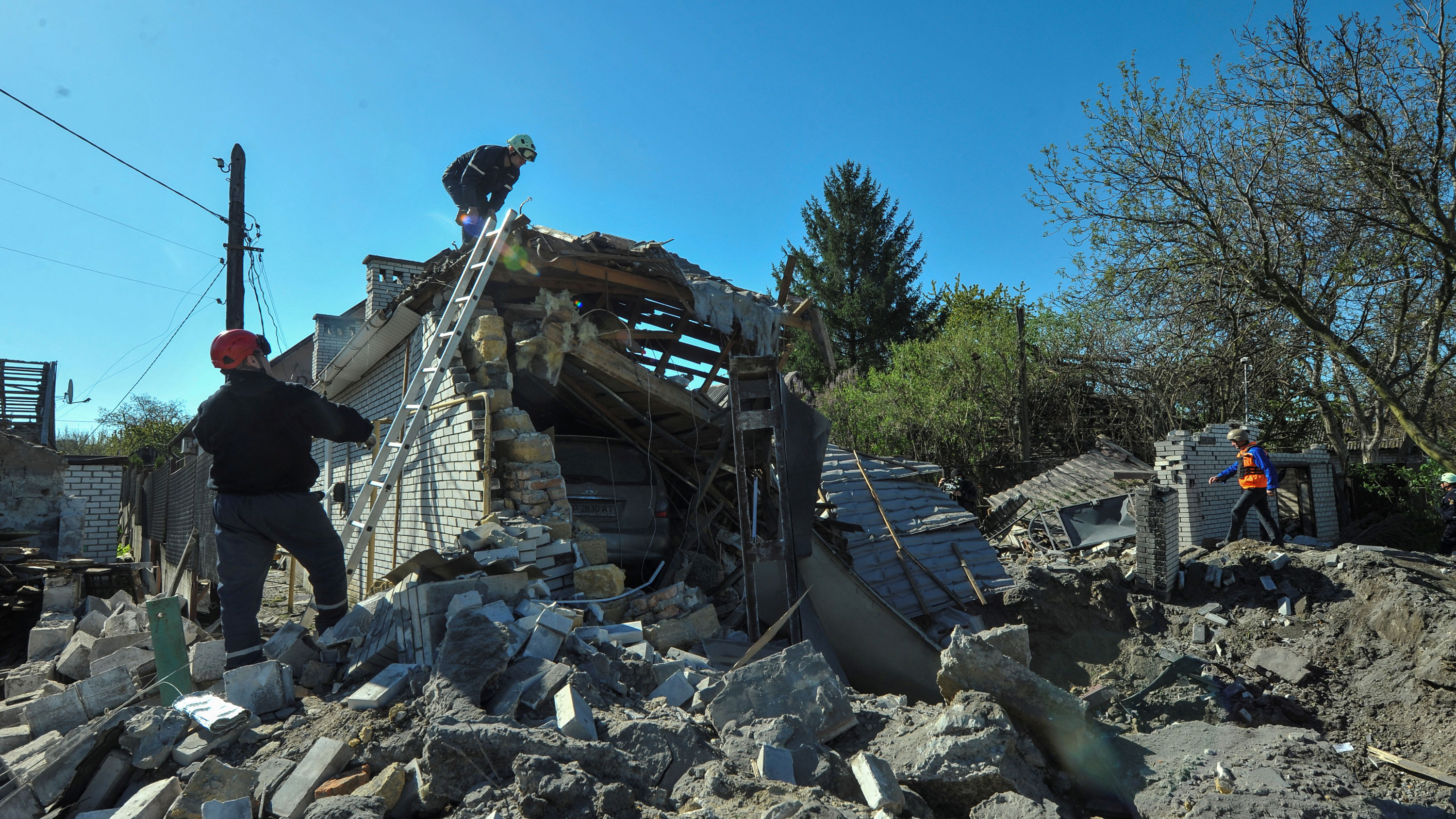 Rescuers work at the site of a residential area heavily damaged by a Russian missile strike, amid Russia's attack on Ukraine, in Zaporizhzhia, Ukraine on May 3, 2023.