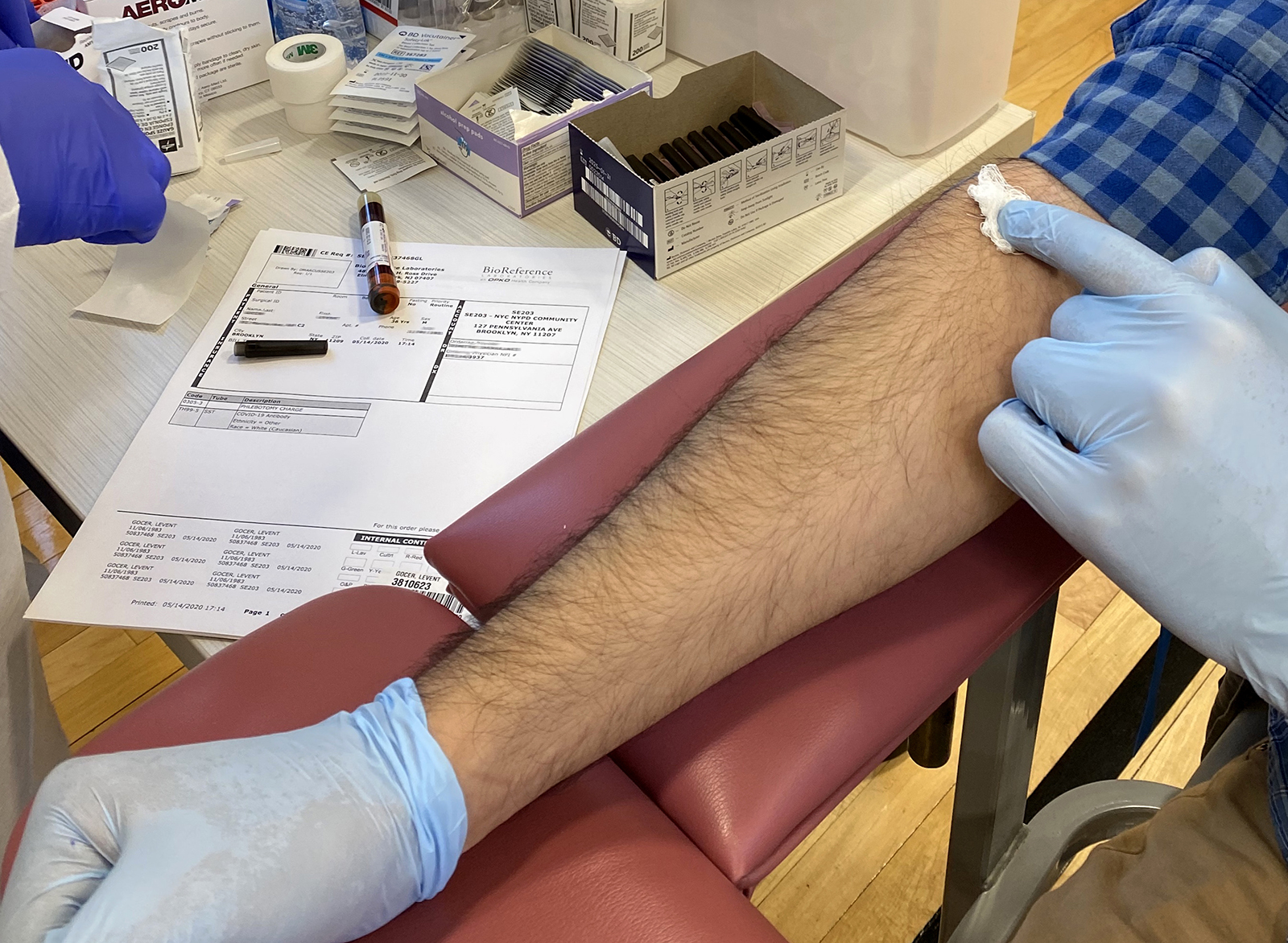 A man gets coronavirus antibody testing at the NYPD Community Center in Brooklyn, New York, on Friday, May 15.