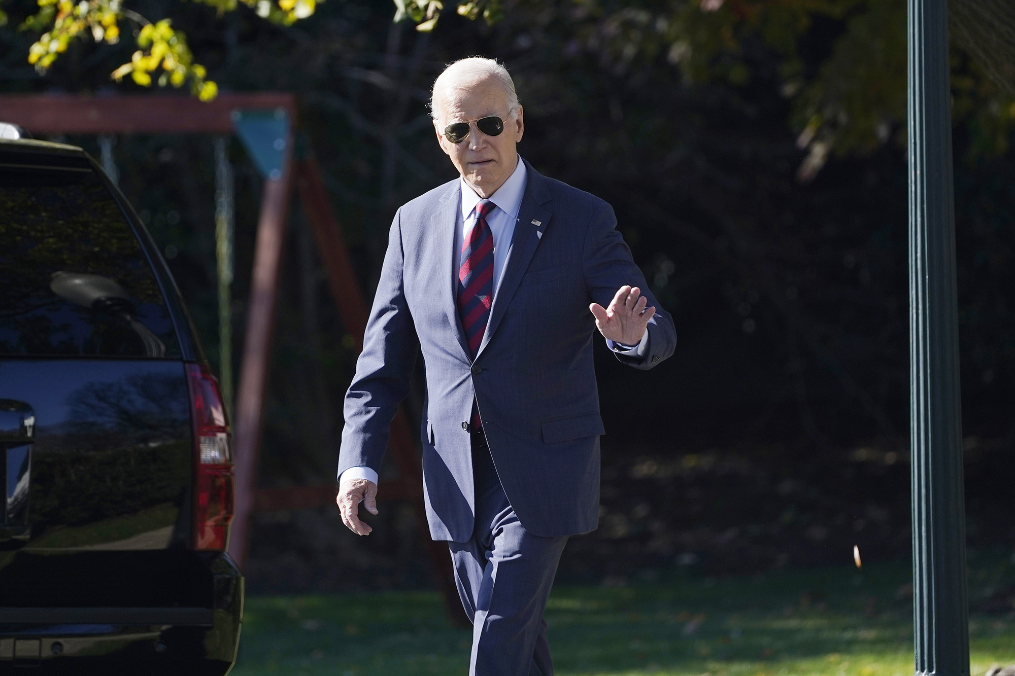 US President Joe Biden walks across the South Lawn of the White House in Washington DC, on November 14, to board Marine One.