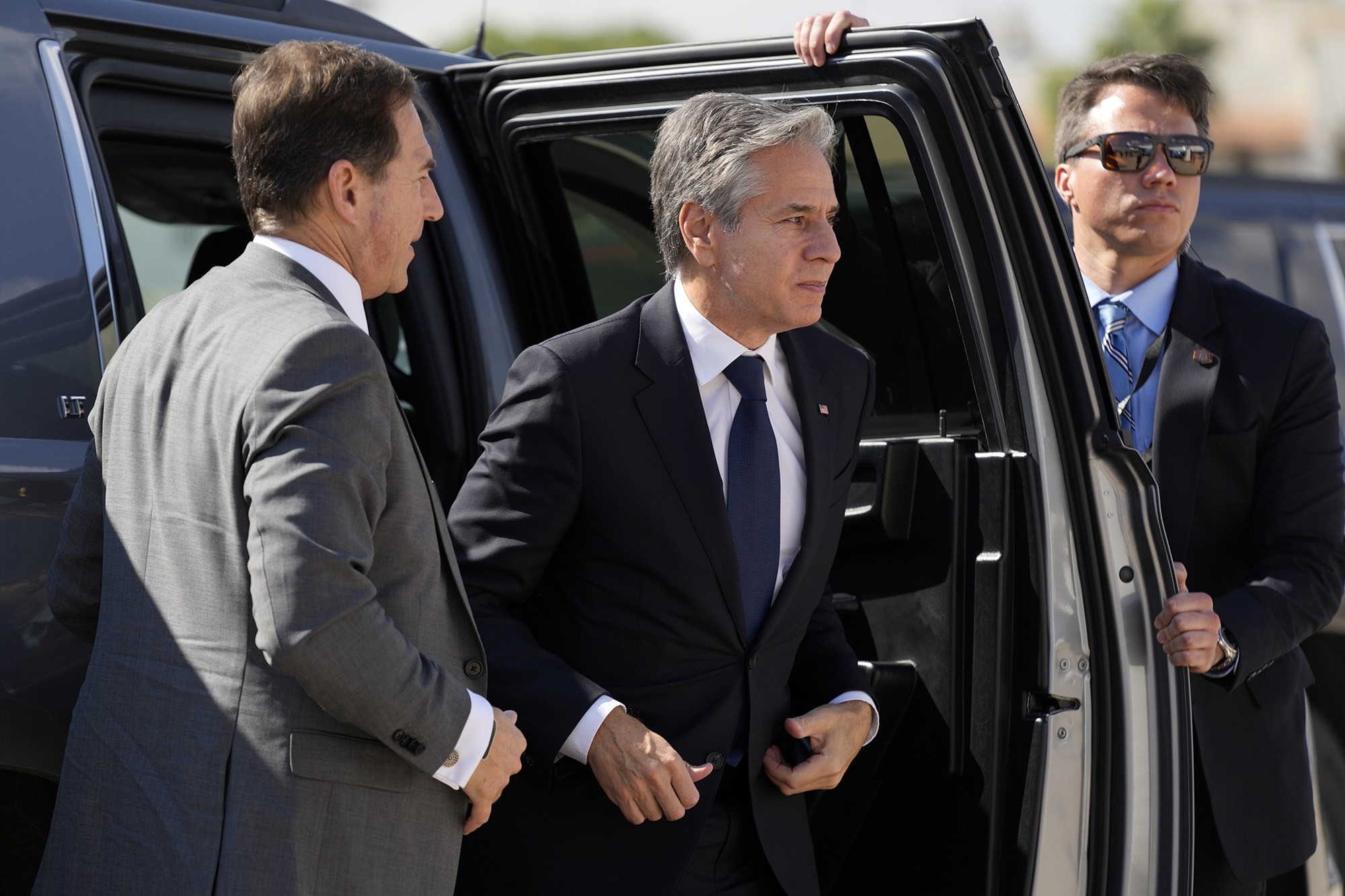 U.S. Secretary of State Antony Blinken, center, arrives at the airport to depart from Amman, Jordan, on October 16, en route to Israel.