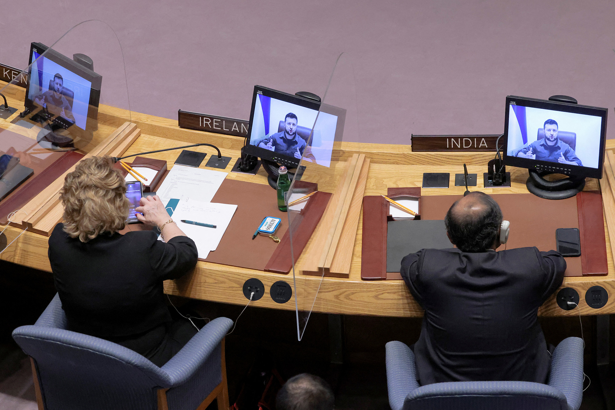 Ukrainian President Volodymyr Zelensky appears on screens as he addresses the United Nations Security Council via video link during a meeting at the United Nations Headquarters in Manhattan, New York City, on  April 5.