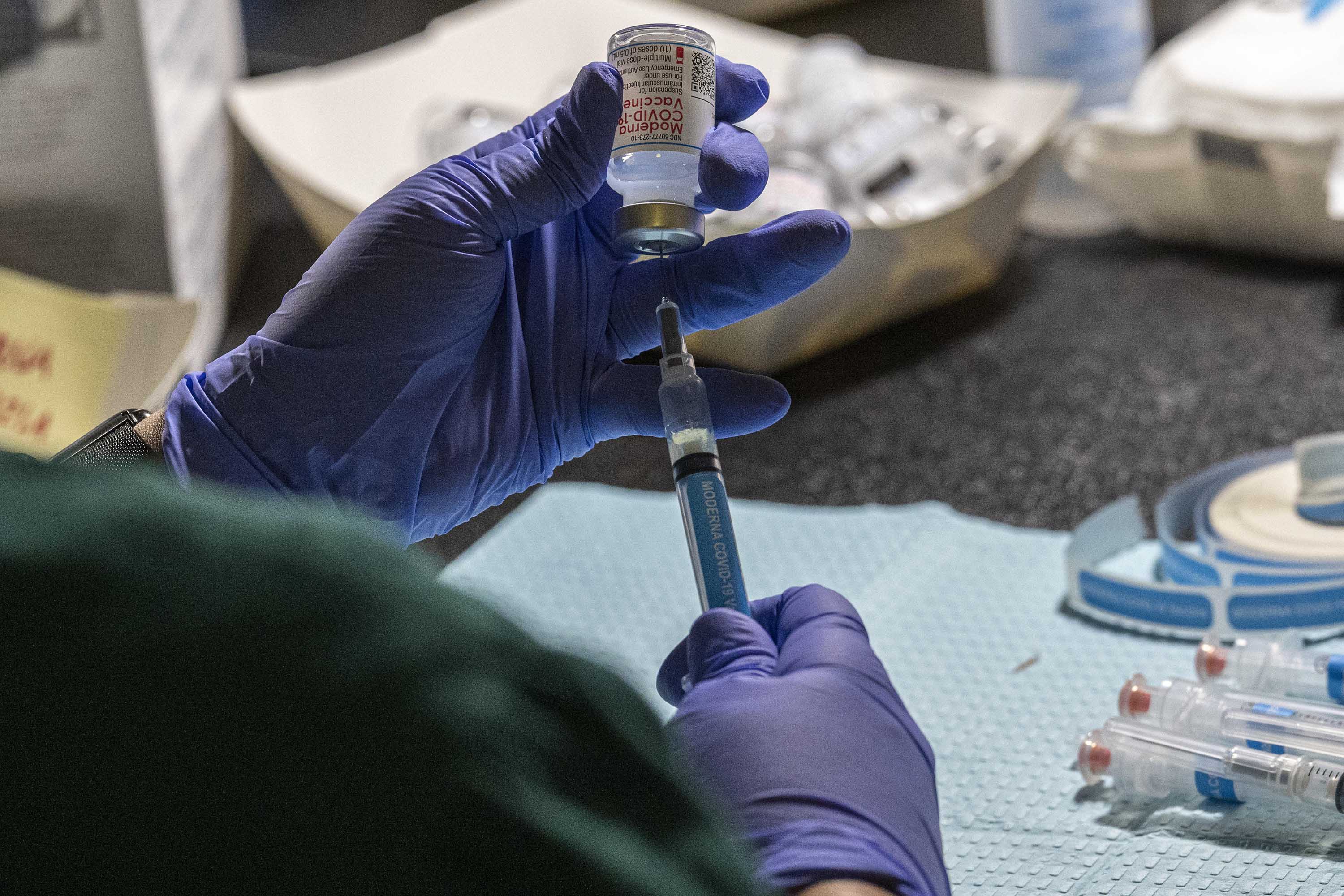 A healthcare worker fills a syringe with a dose of the Moderna Inc. Covid-19 vaccine at a vaccination site in Richmond, California, on April 15. 