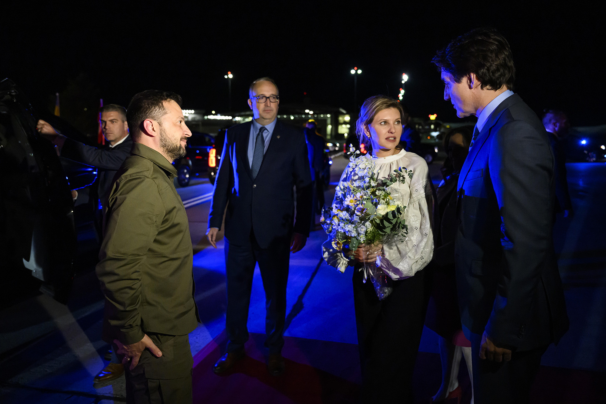 Canadian Prime Minister Justin Trudeau, right, speaks with Ukrainian President Volodymyr Zelensky, left, and his wife Olena Zelenska after their arrival at Ottawa Macdonald-Cartier International Airport in Ottawa, Ontario, on September 21.