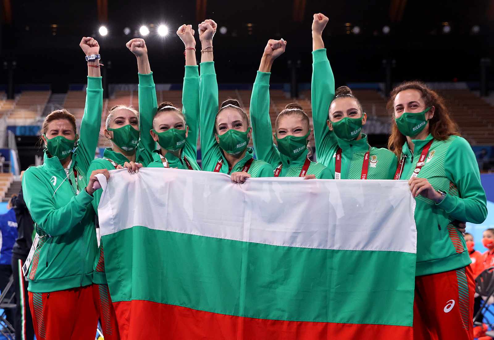 Team Bulgaria celebrates after winning the gold in women’s rhythmic gymnastics group all-around on Sunday.