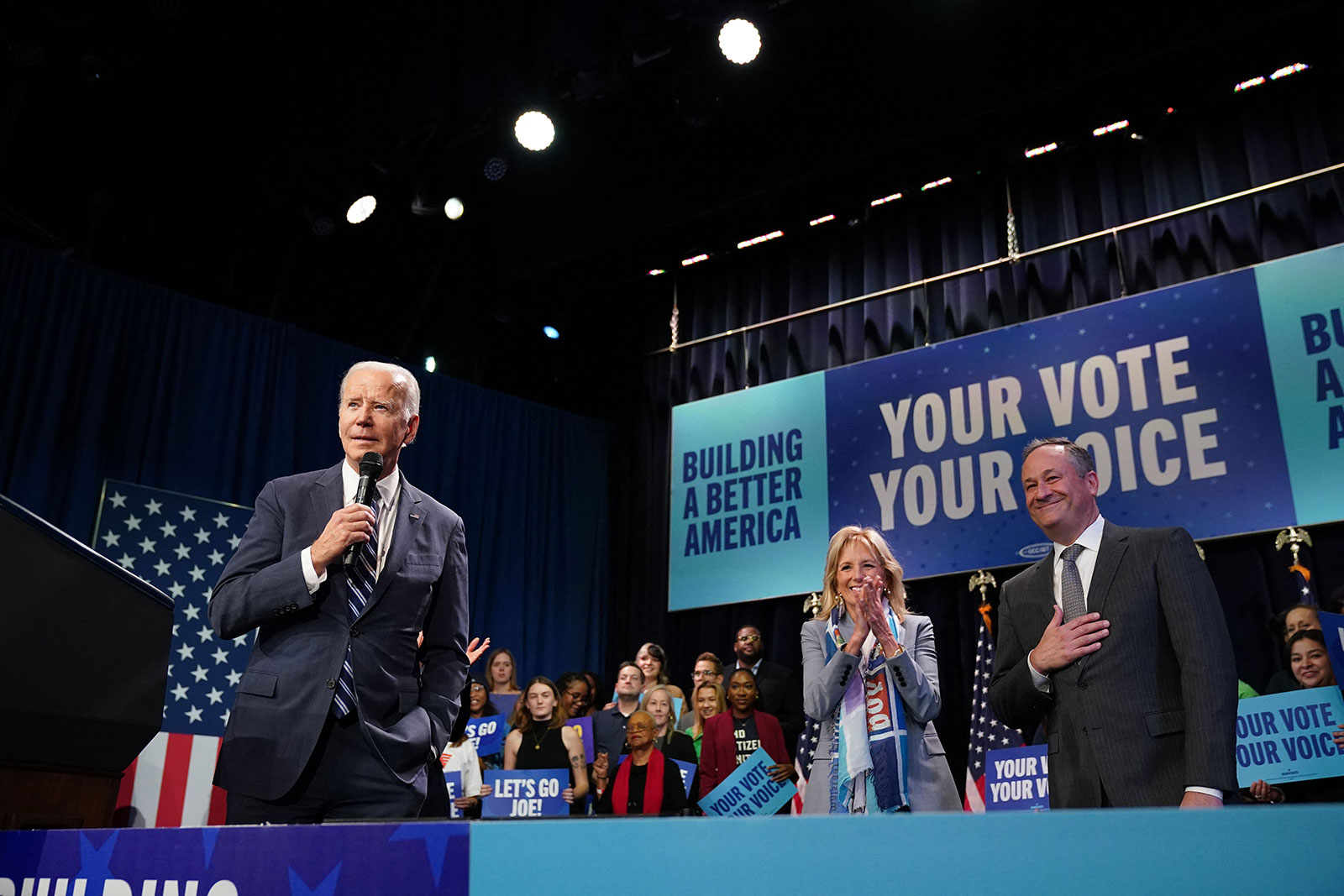 President Joe Biden, with first lady Jill Biden and second gentleman Doug Emhoff, speaks at an event hosted by the Democratic National Committee to thank campaign workers at Howard Theatre in Washington, DC, on November 10. 