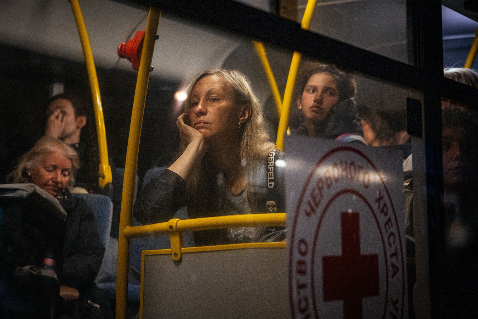 People evacuated from Mariupol arrive on buses at a registration and processing area for internally displaced people in Zaporizhzhia, Ukraine, on May 8.