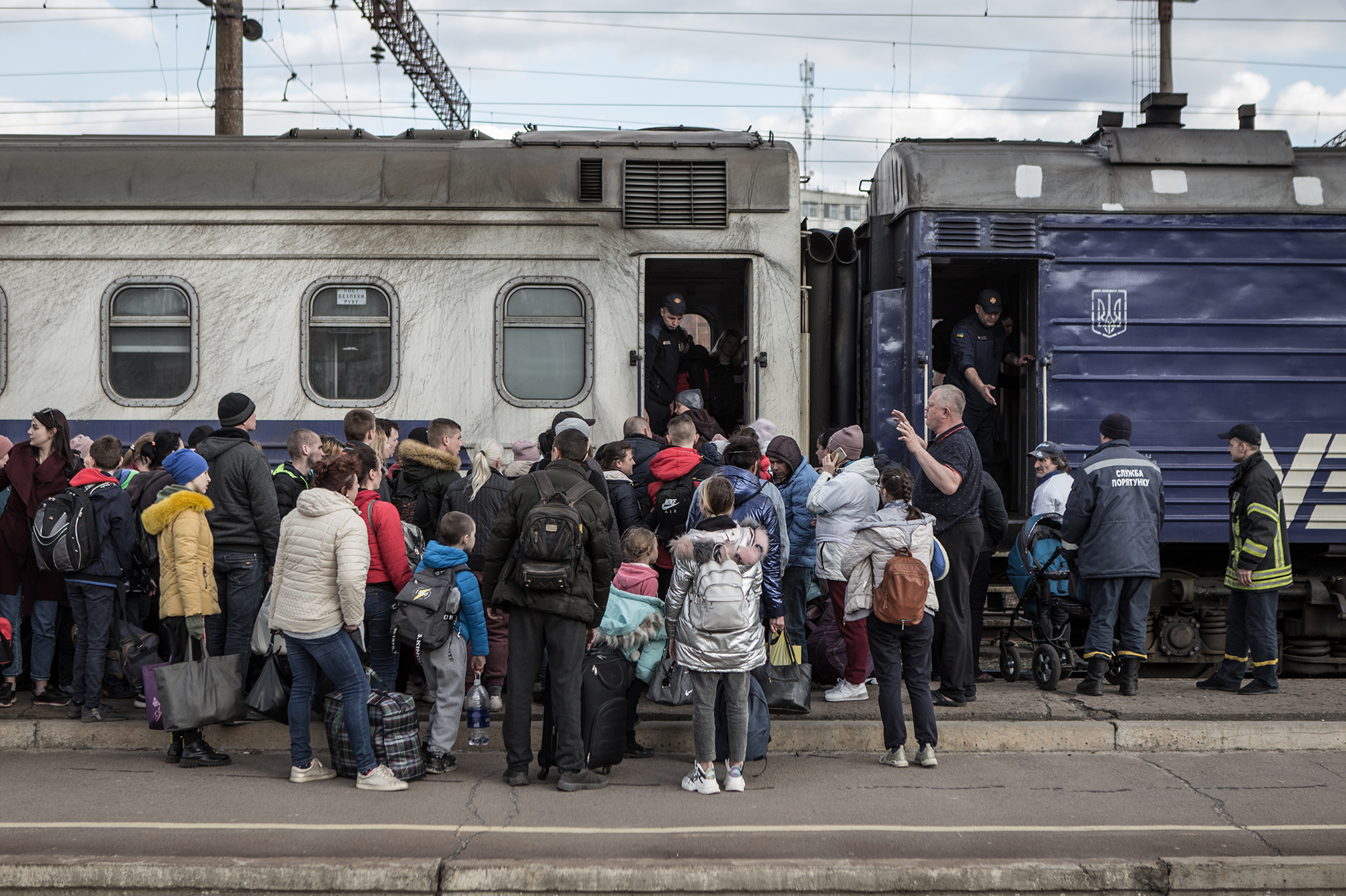 Civilians board a train as they are being evacuated from combat zones in Kramatorsk, Donetsk Oblast, in eastern Ukraine, on April 6.