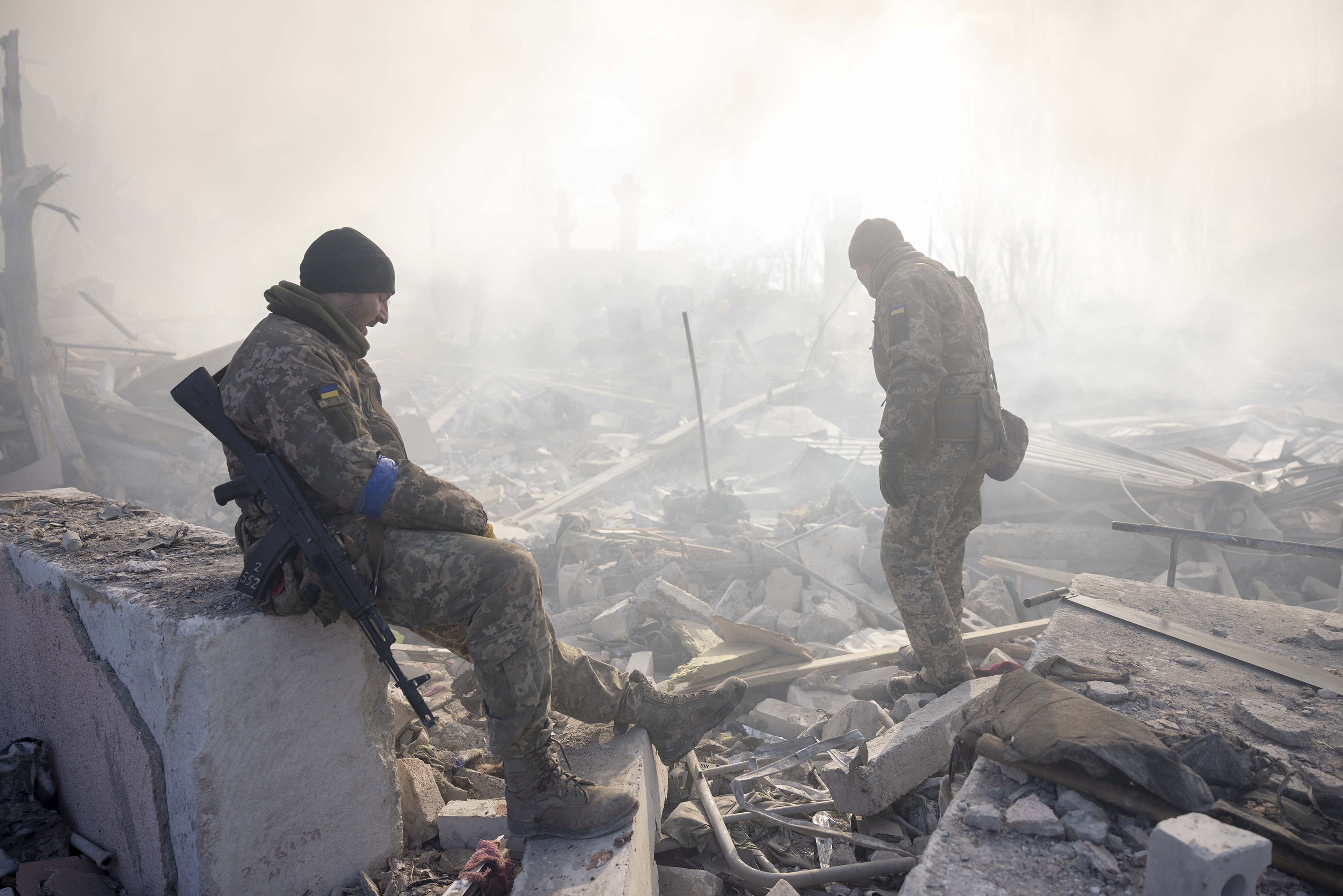 Soldiers conduct search efforts at the scene of a missile strike in Mykolaiv, Ukraine. 