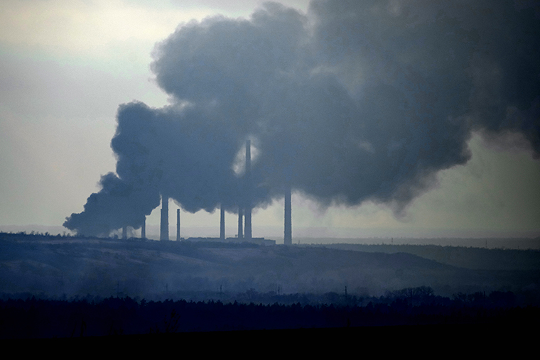 Smoke billows from a power and heating plant Tuesday after it was shelled in Shchastya, near Luhansk in eastern Ukraine.