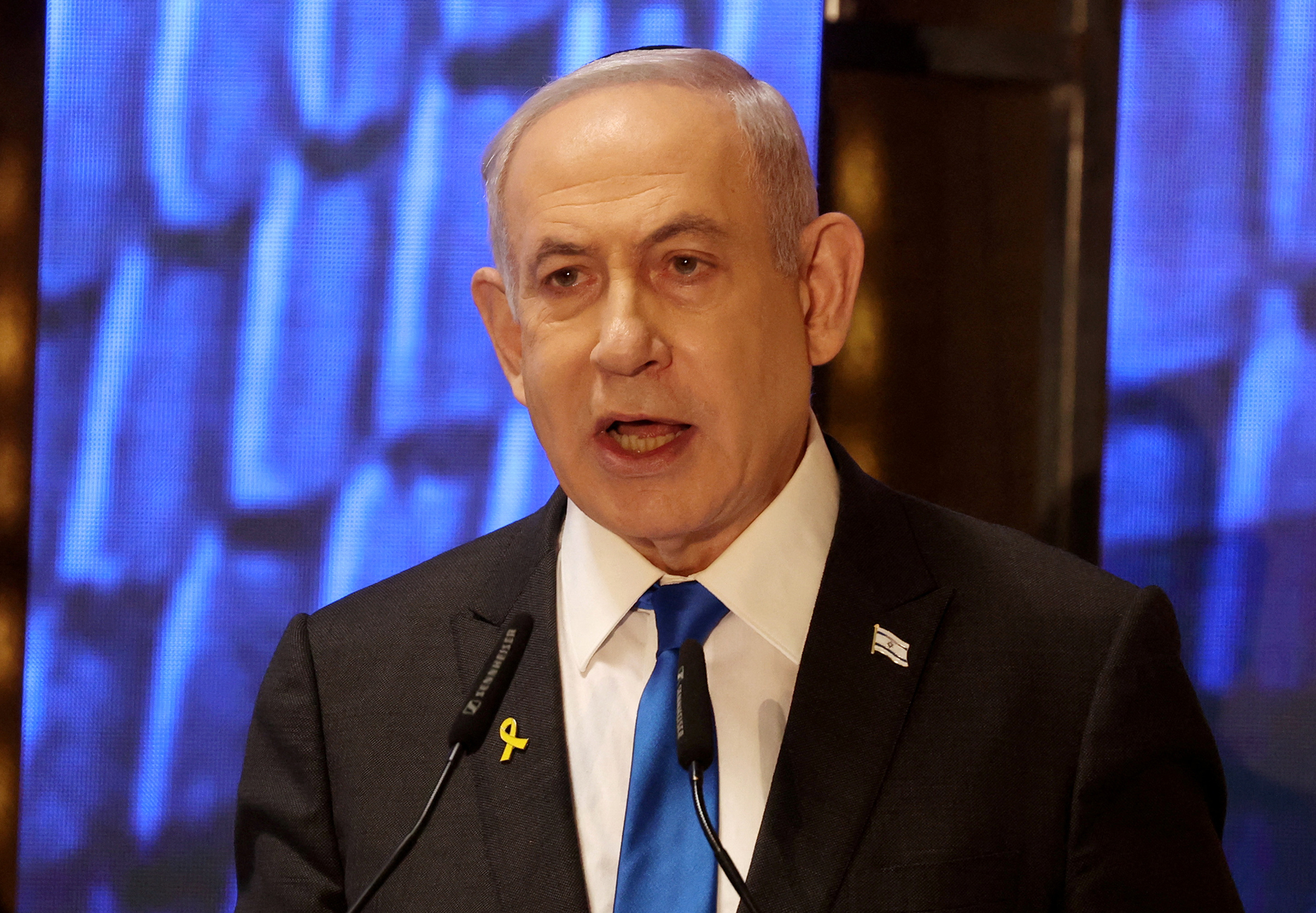 Israeli Prime Minister Benjamin Netanyahu speaks during a ceremony marking Memorial Day for fallen soldiers of Israel's wars and victims of attacks, at Jerusalem's Mount Herzl military cemetery, on May 13.