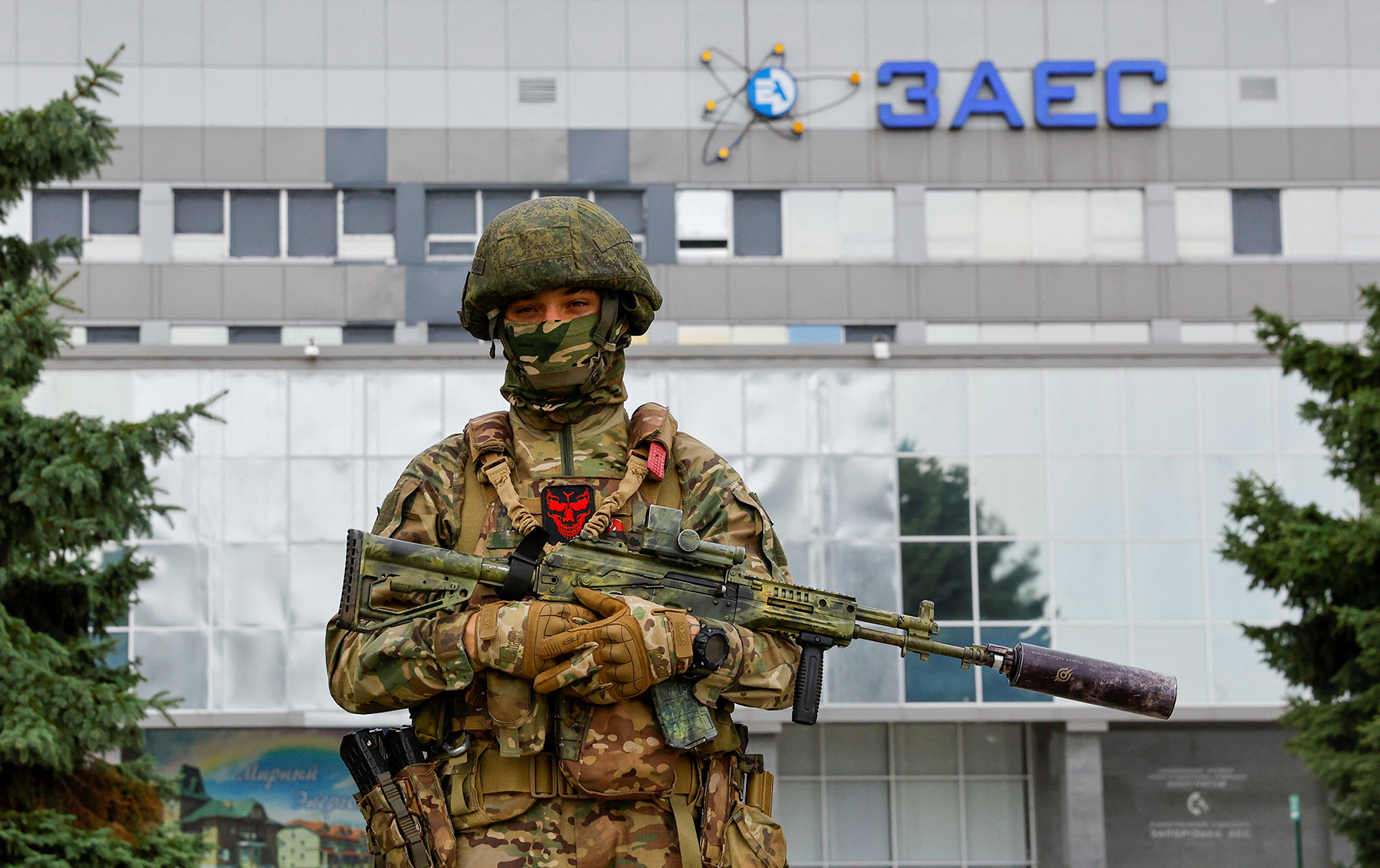 A Russian soldier stands guard near the Russian-controlled Zaporizhzhia nuclear power plant following the arrival of the International Atomic Energy Agency (IAEA) expert mission in Ukraine, on September 1.