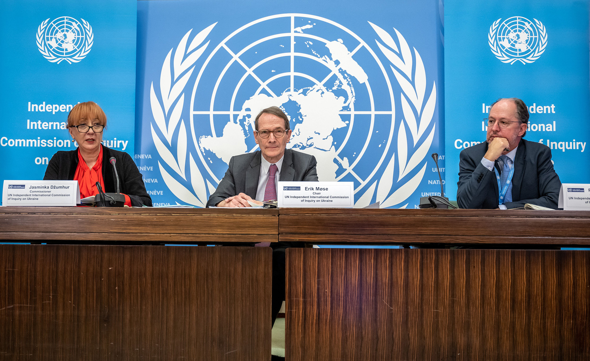 Chair of the Independent International Commission of Inquiry on Ukraine, Erik Mose, center, and members Jasminka Dzumhur, left, and Pablo de Greiff attend a news conference to present the report containing their latest findings in Geneva on March 16.