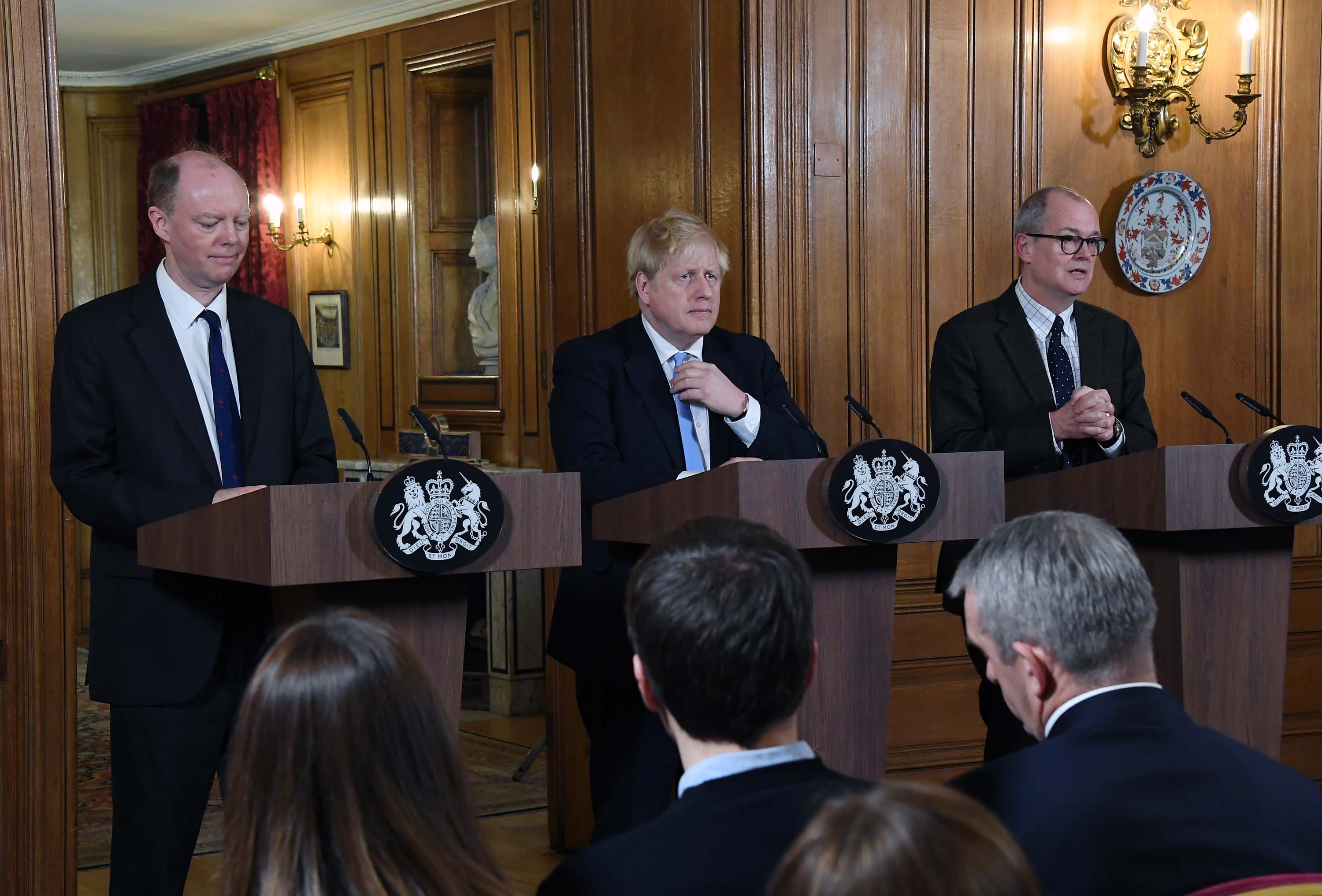From left: Chief Medical Officer for England Chris Whitty, UK Prime Minister Boris Johnson, and Chief Scientific Adviser Patrick Vallance speak during a press conference in London, England, on March 9.