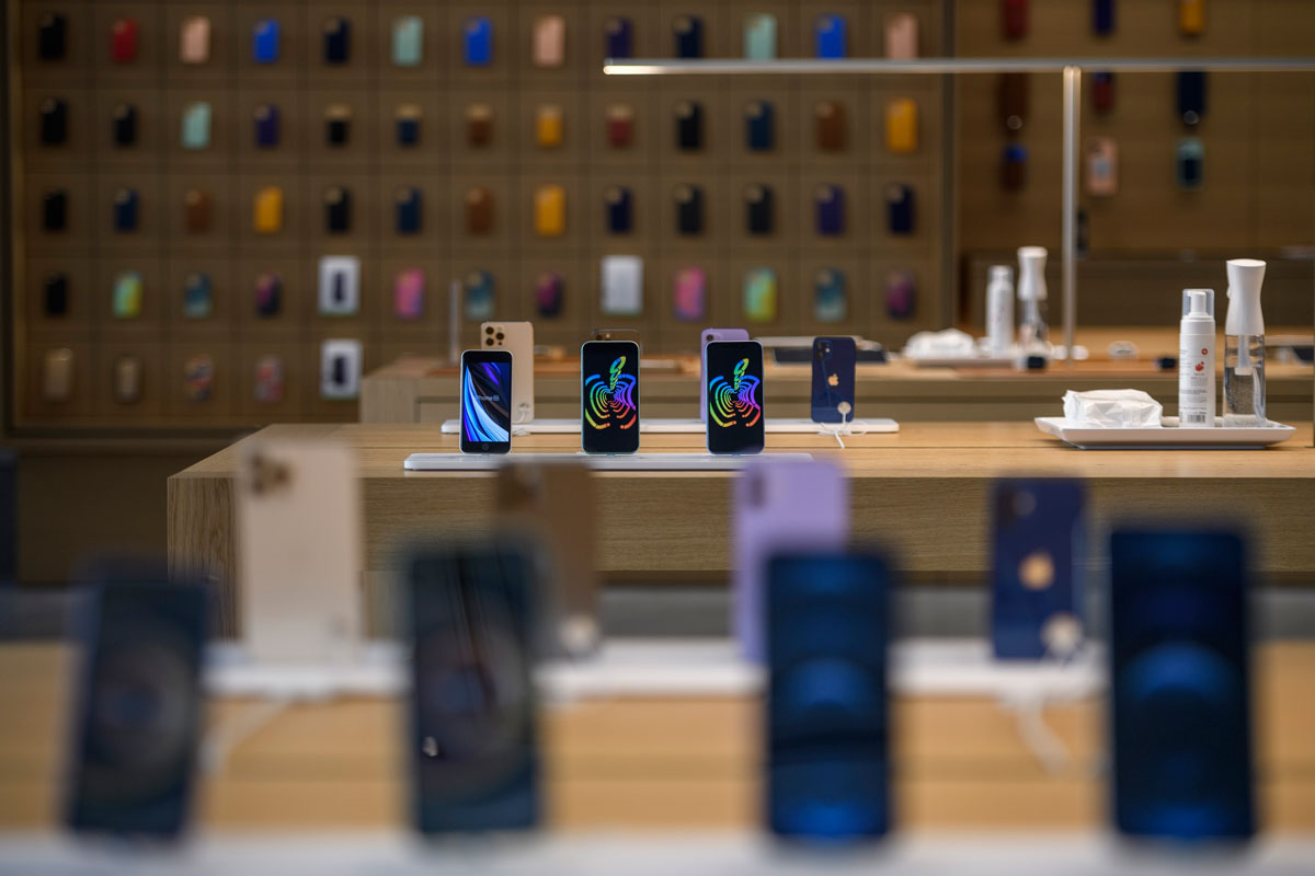 Various iPhone models sit on display at the official opening of the new Apple Store Via Del Corso, in Rome, Italy on May 27.