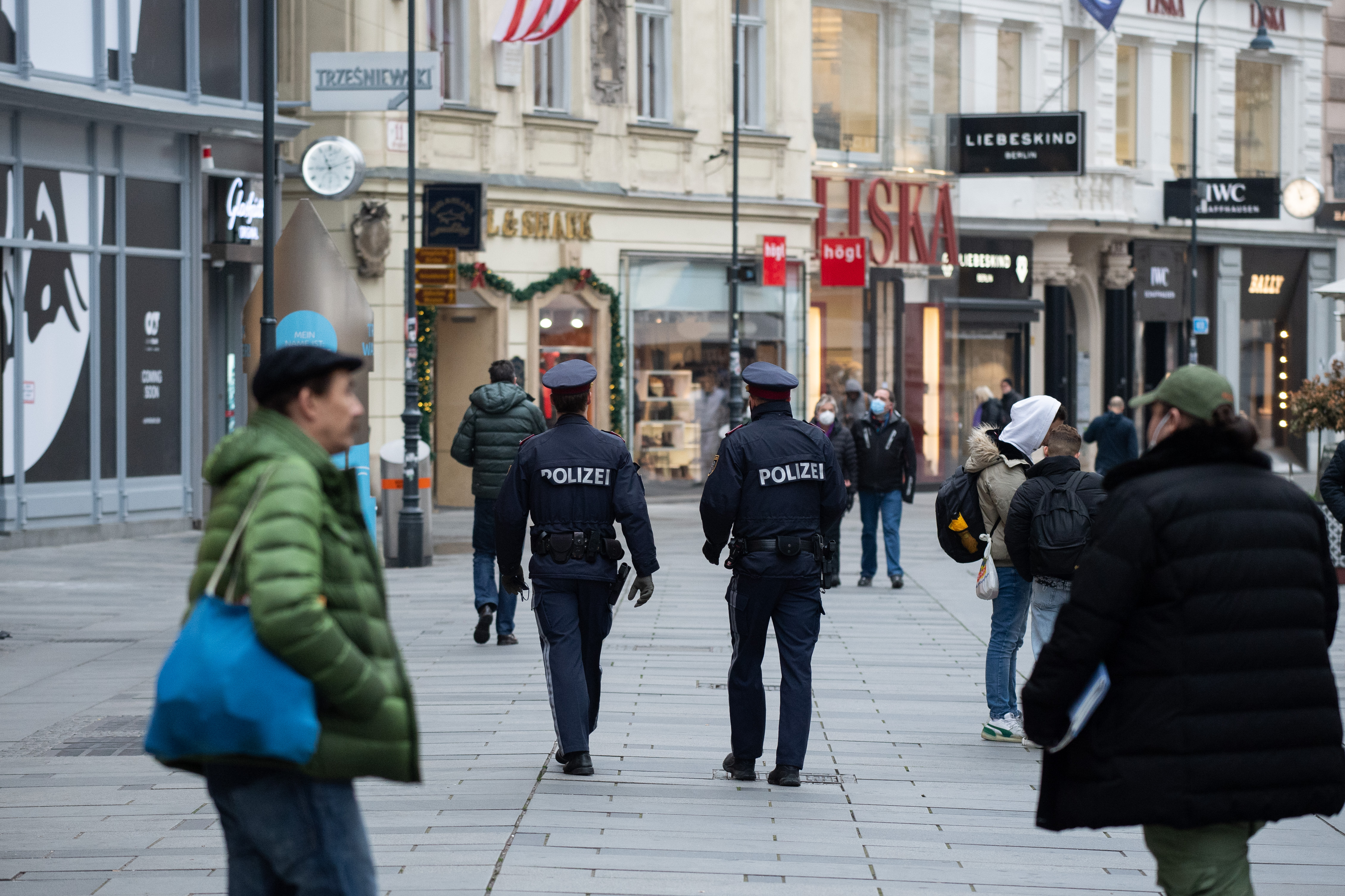 Police patrols 'Am Graben' shopping street on the first day of a nationwide, temporary lockdown during the fourth wave of the novel coronavirus pandemic on November 22nd, 2021 in Vienna, Austria.