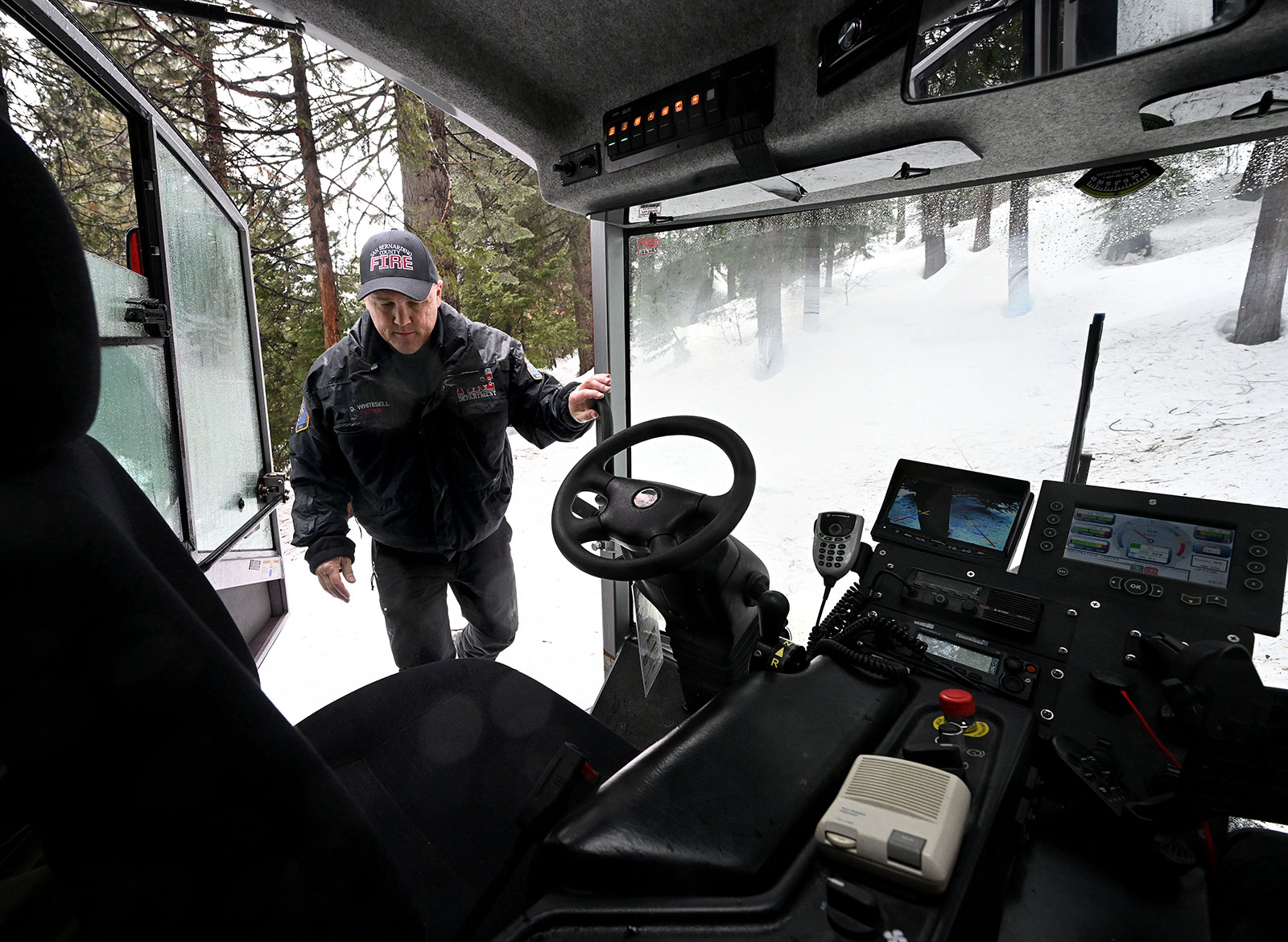 San Bernardino County fire department captain Don Whitesell prepares to drive a snowcat in Lake Arrowhead, California, on March 10. 